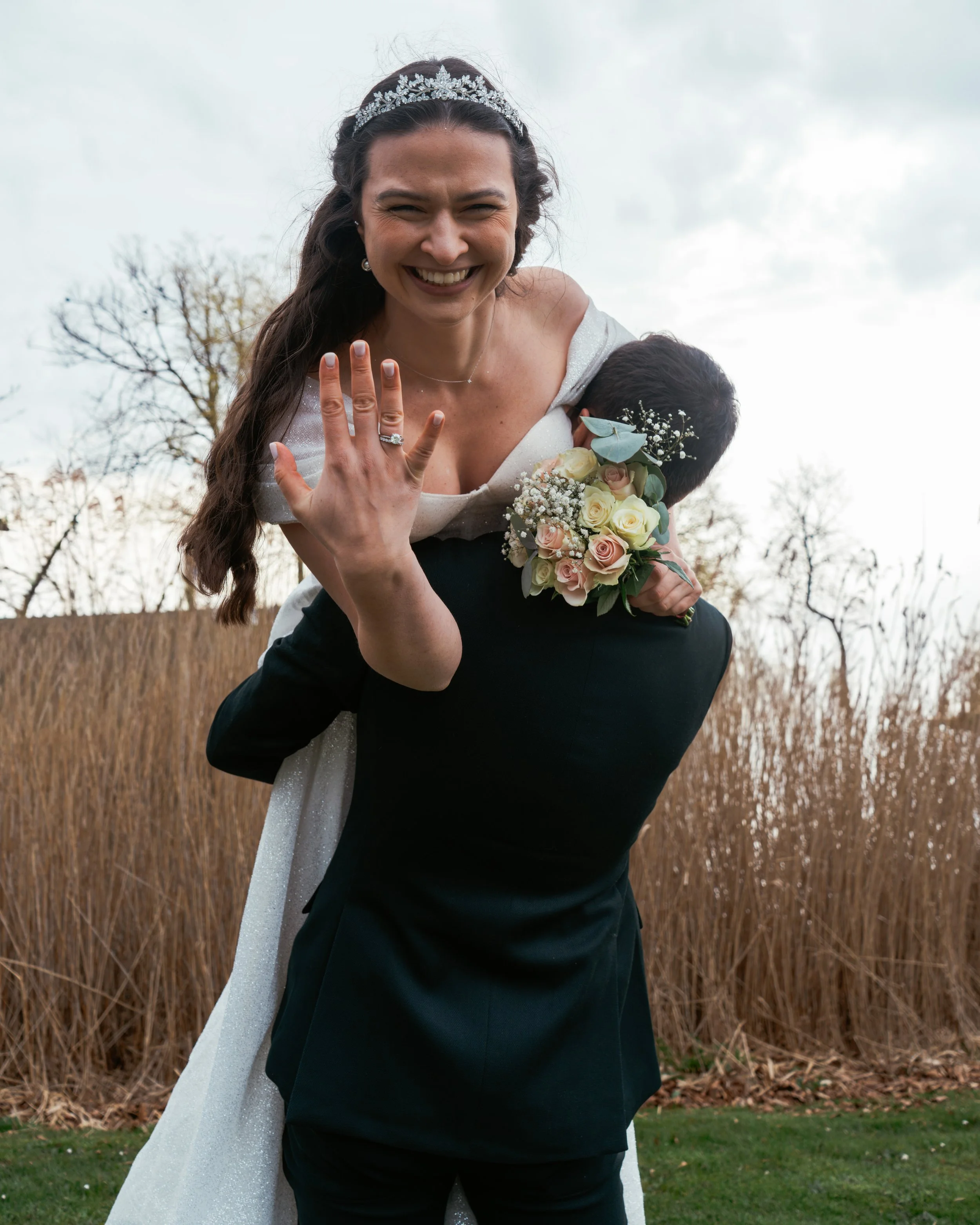 Couple walking into the landscape after their wedding on Ærø, Denmark
