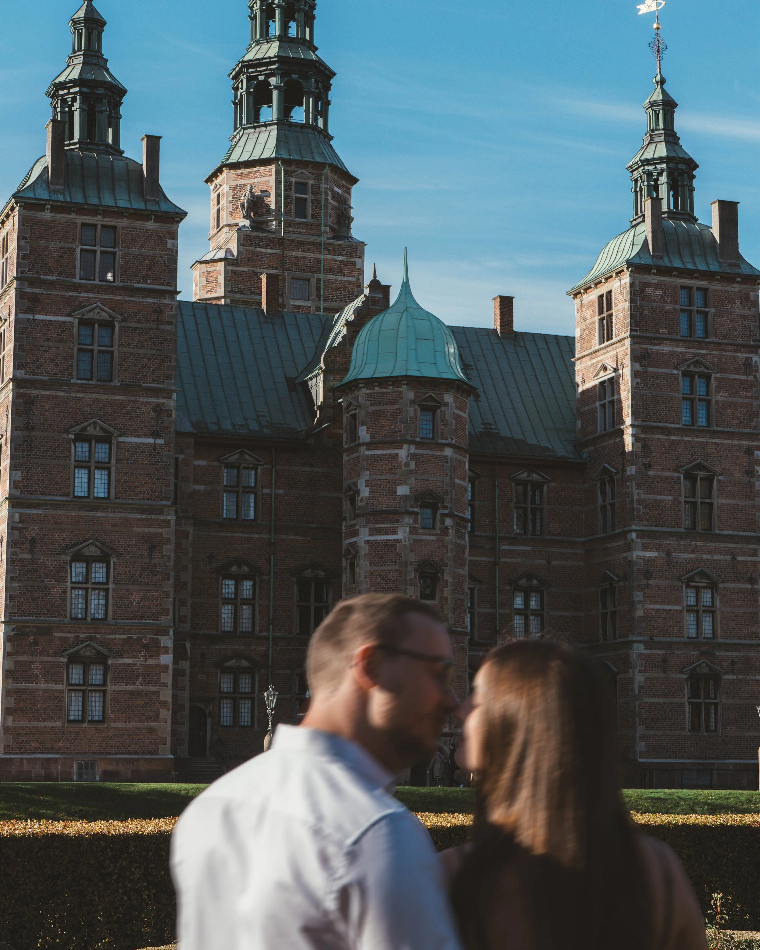 Couples photography in Copenhagen near Rosenborg Castle capturing a relaxed, romantic portrait with a timeless European feel.