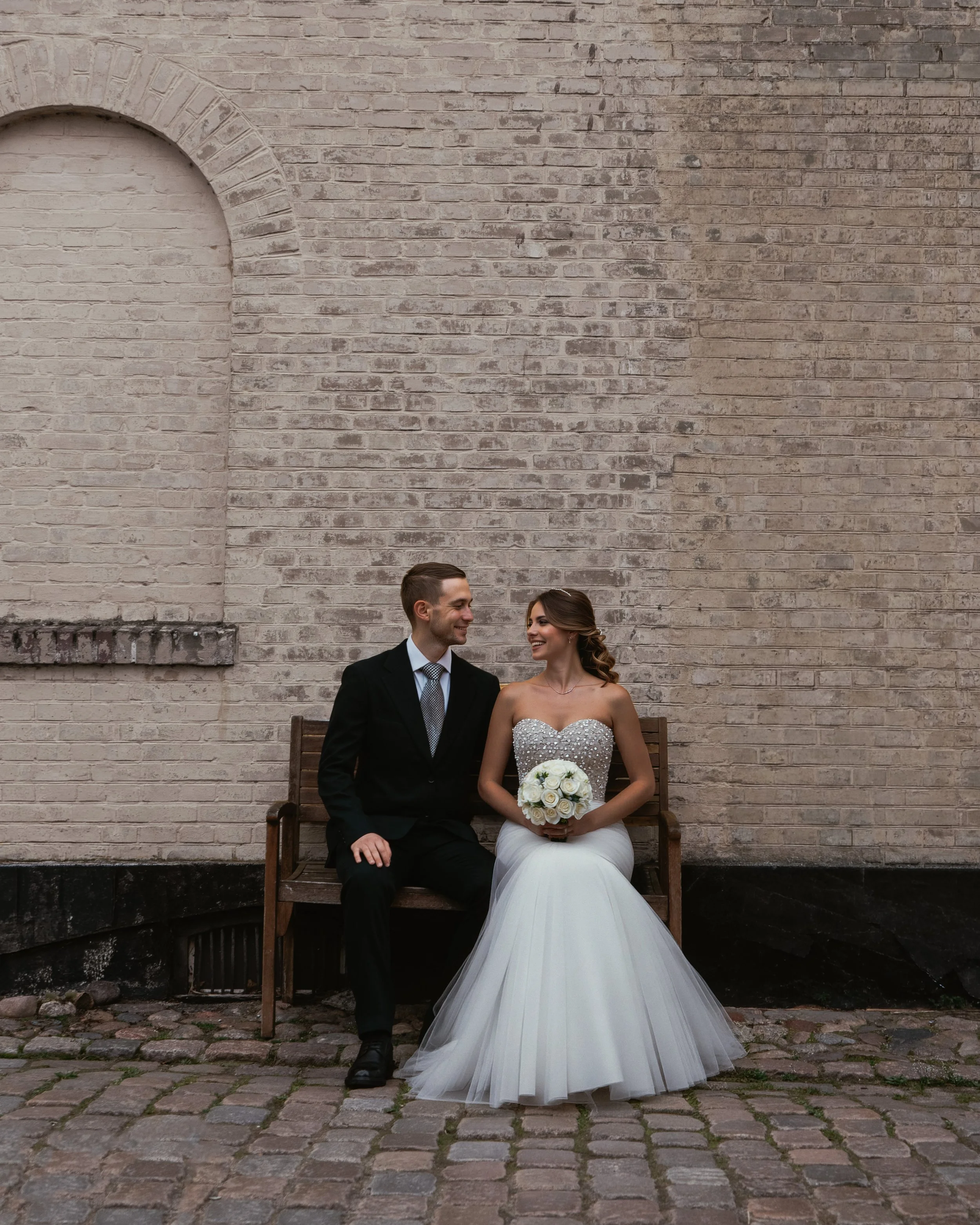 Close-up of wedding rings and hands during a Copenhagen wedding celebration