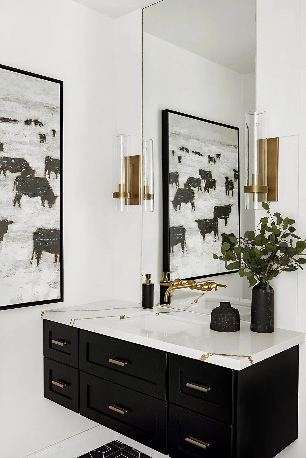 Modern black floating bathroom vanity with brass hardware and white quartz countertop