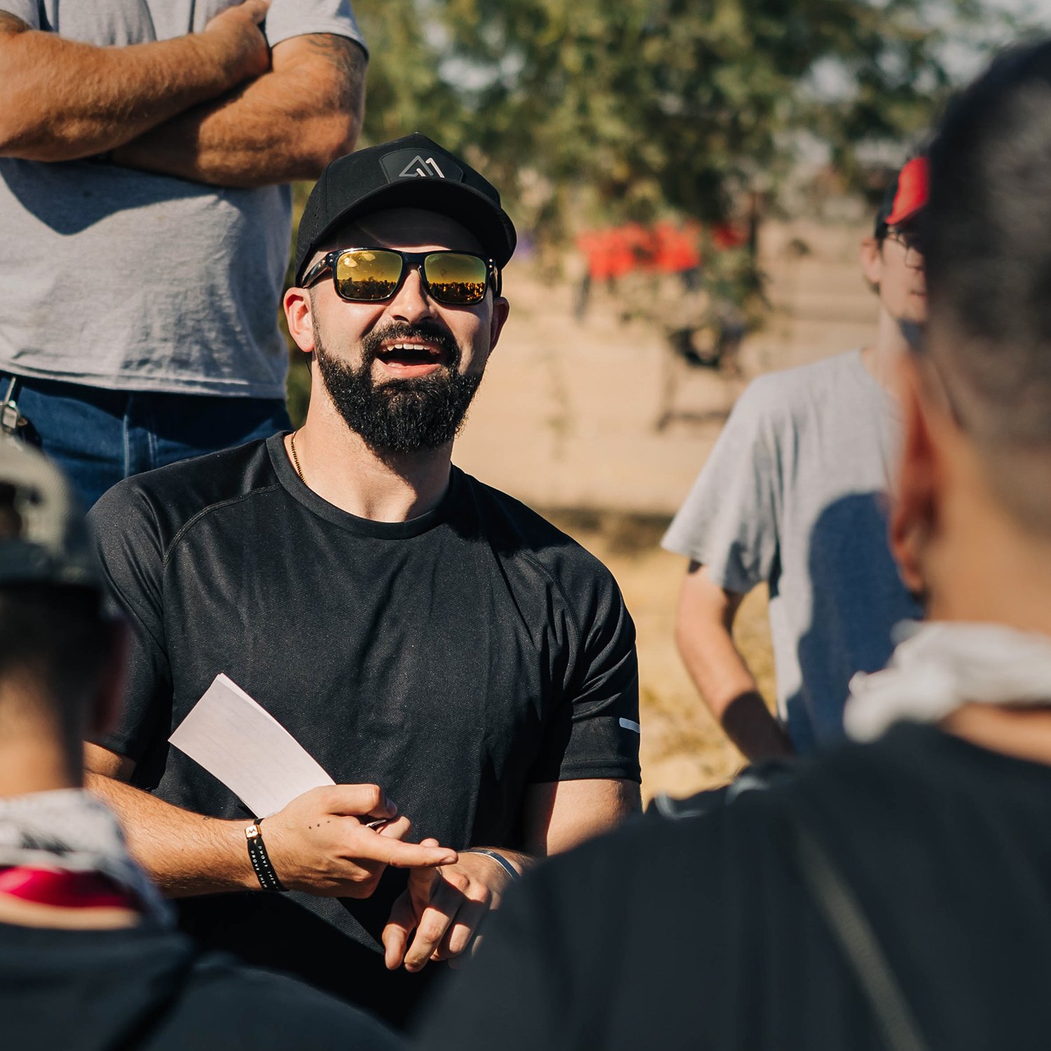 Nick helps a crowd of veterans prepare for a fun UTV ride.jpg