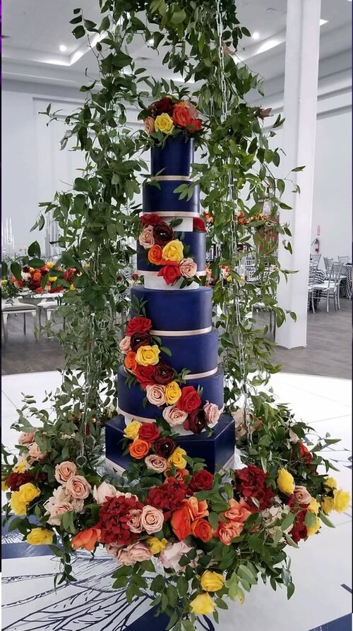  navy blue wedding cake with colorful flowers 