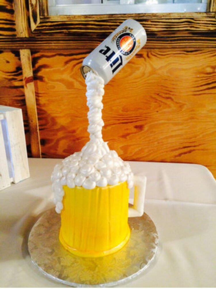  creative grooms cake looks like beer being poured into a mug 