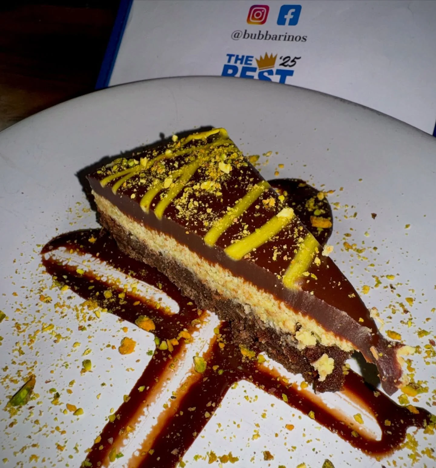 Dubai Chocolate Torte Cake | Limited Time Offer 🔥

This indulgent dessert layers a rich chocolate graham crust with silky ganache and a crunchy pistachio-kataifi filling, all topped with more velvety chocolate. Finished with a striking green swirl, 