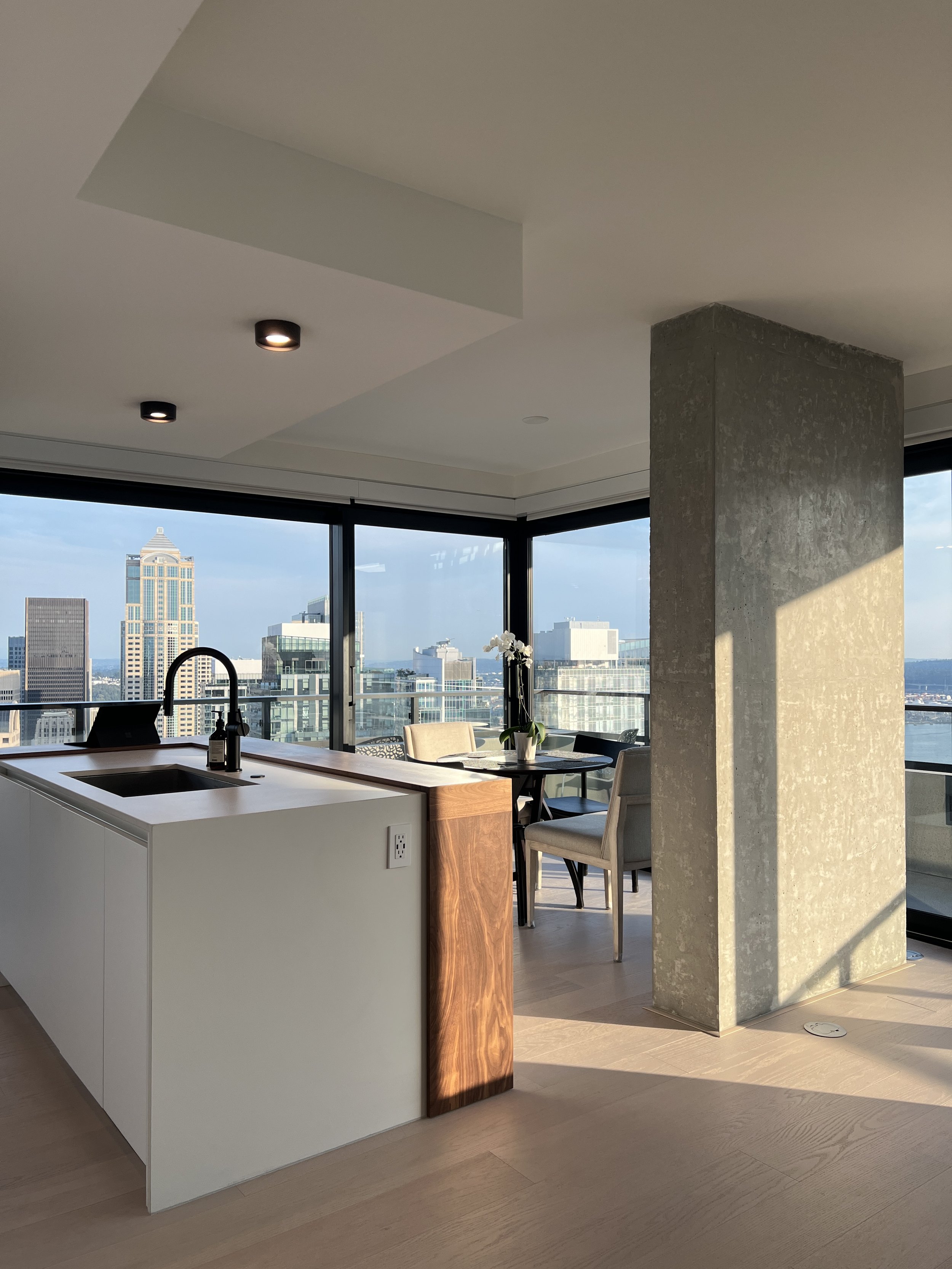 First Light Seattle kitchen custom walnut island Elliott Bay views