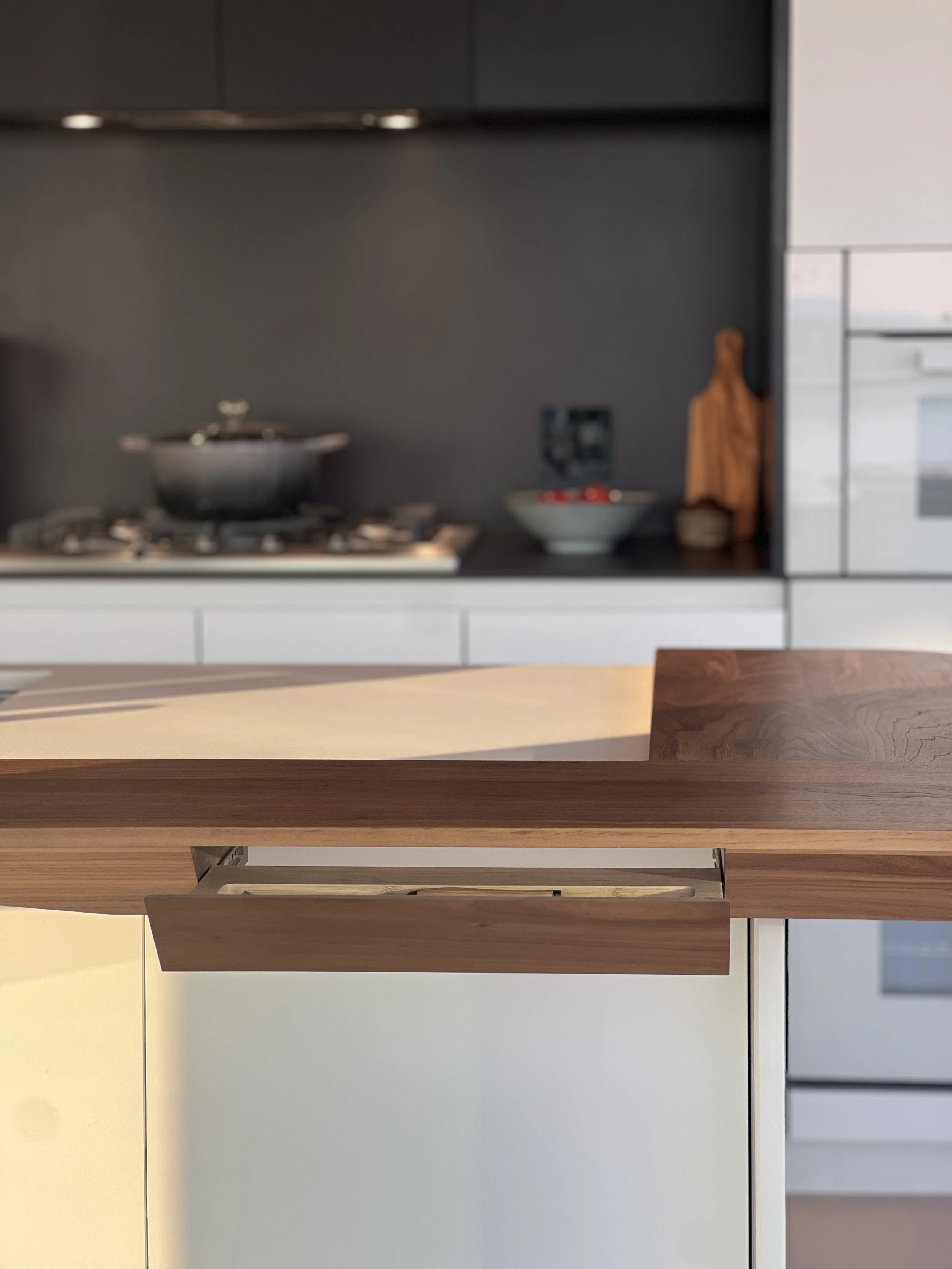 Nested drawers with carved cutlery organizer walnut island