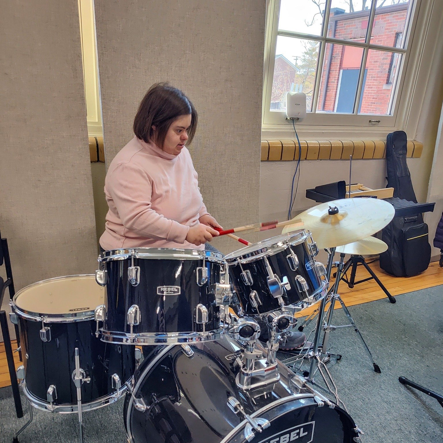 We're so proud of this young lady for trying the drums for the first time!  This semester of Adapted Rock Band, SO MANY of our participants have expressed interest in the drums.  This has given us all the chance to practice taking turns so that our b