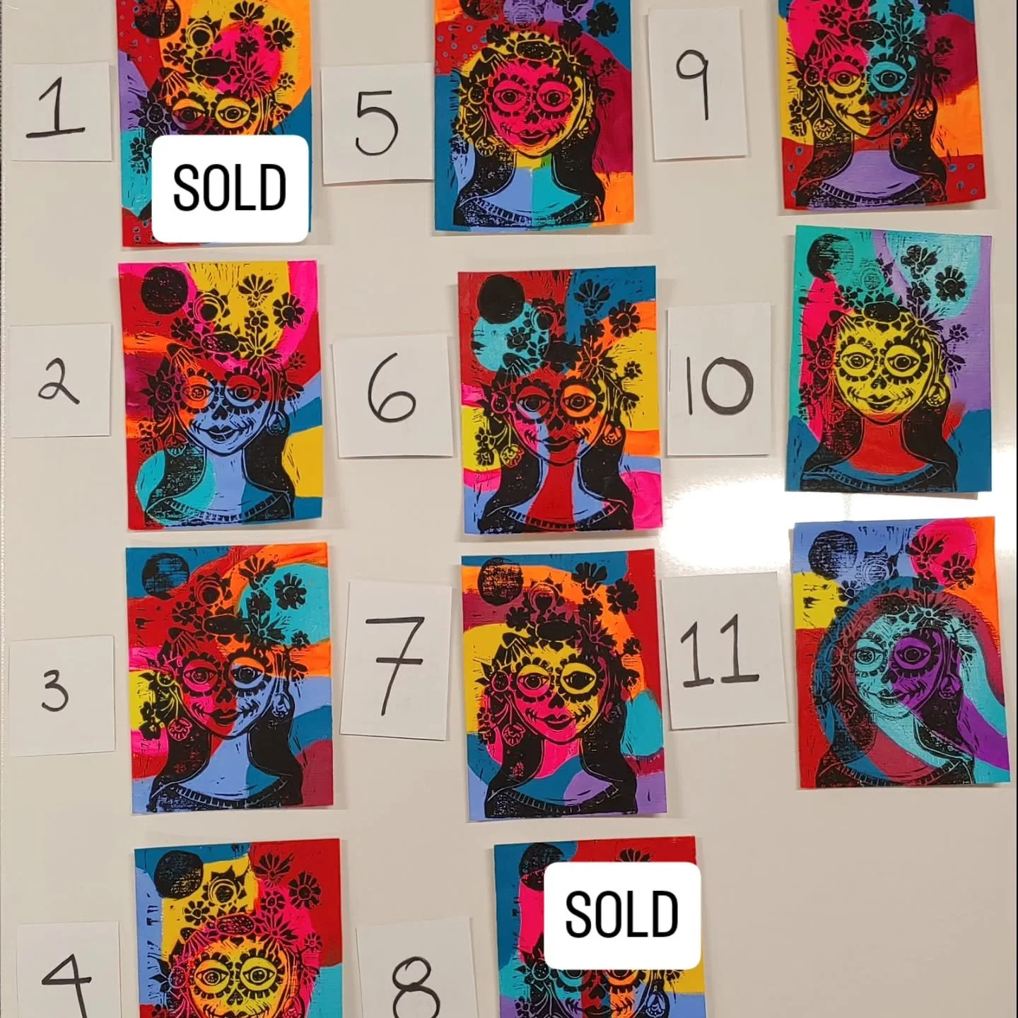 My colorful prints are available for purchase. Painted with bright, bold acrylic paint each print is unique and colorful. I hand drew “La Catrina” and then carved the design on a linocut to be used for the printing process. 
Prints