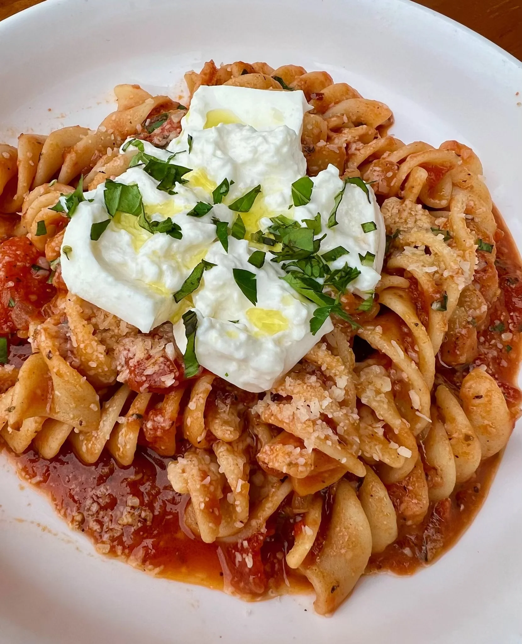 Delicious pasta with homemade red sauce, topped with fresh burrata - Dinner special