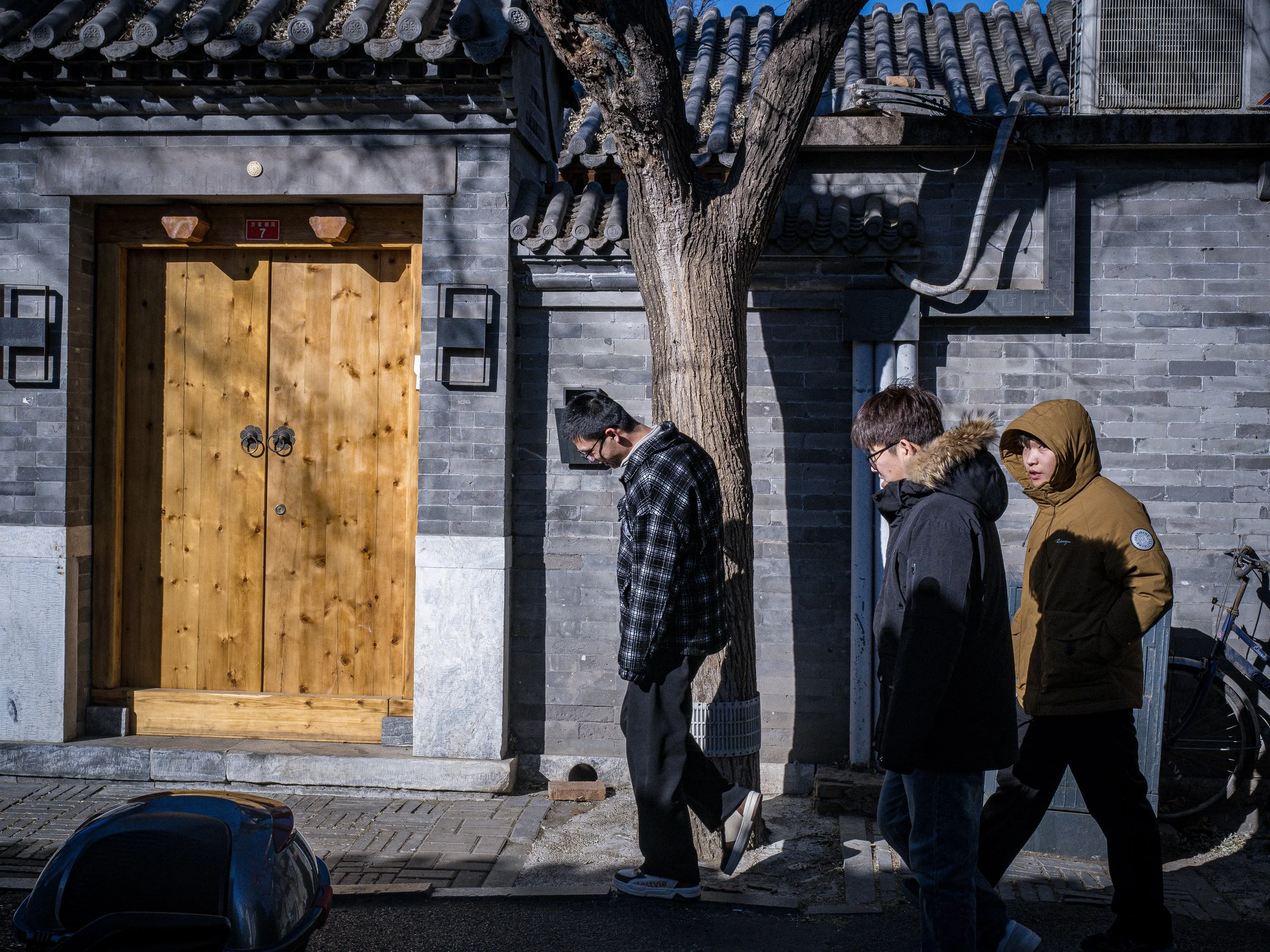 Kids walking down an alley.