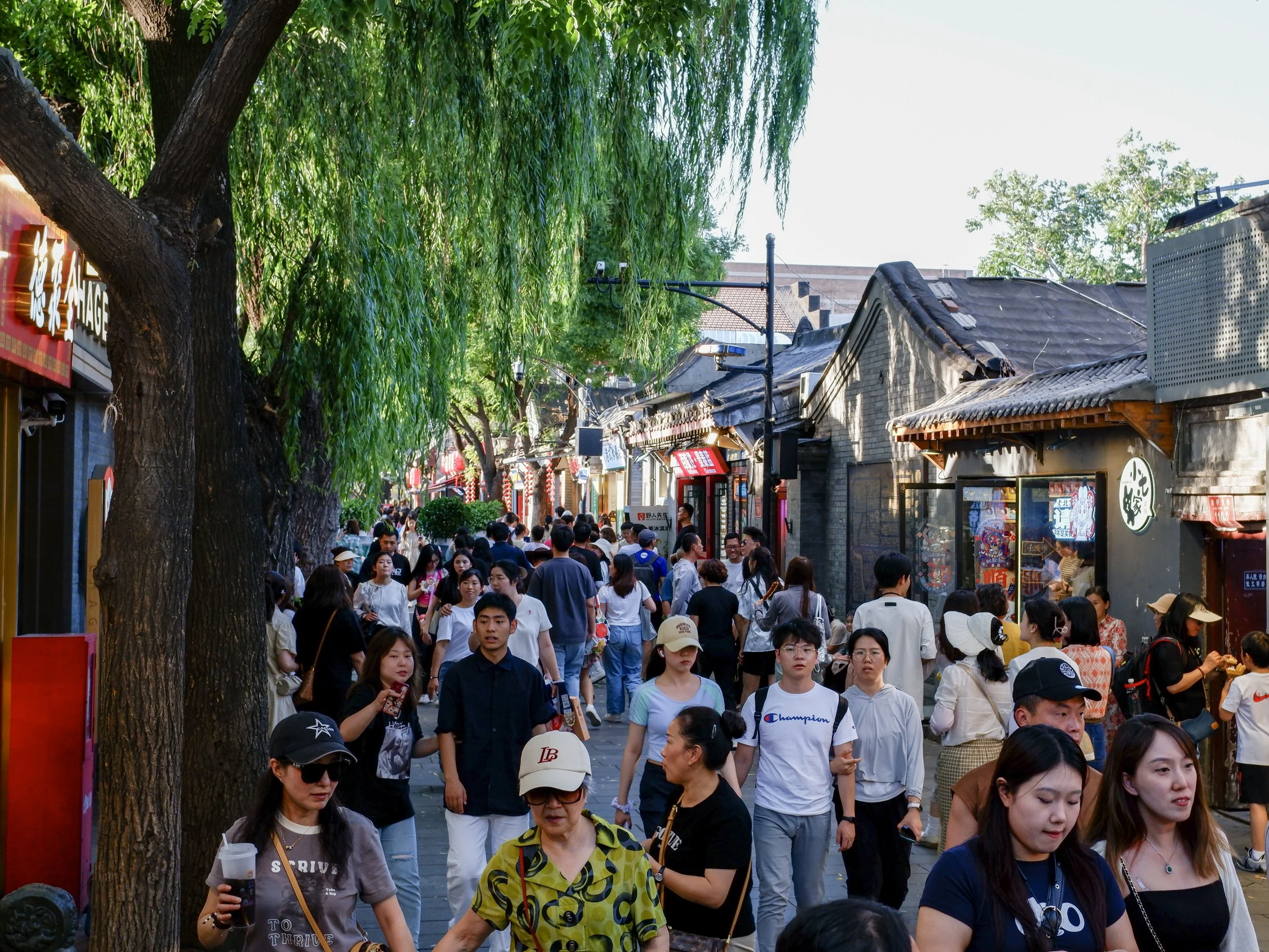 Throngs of shoppers in the hutong.