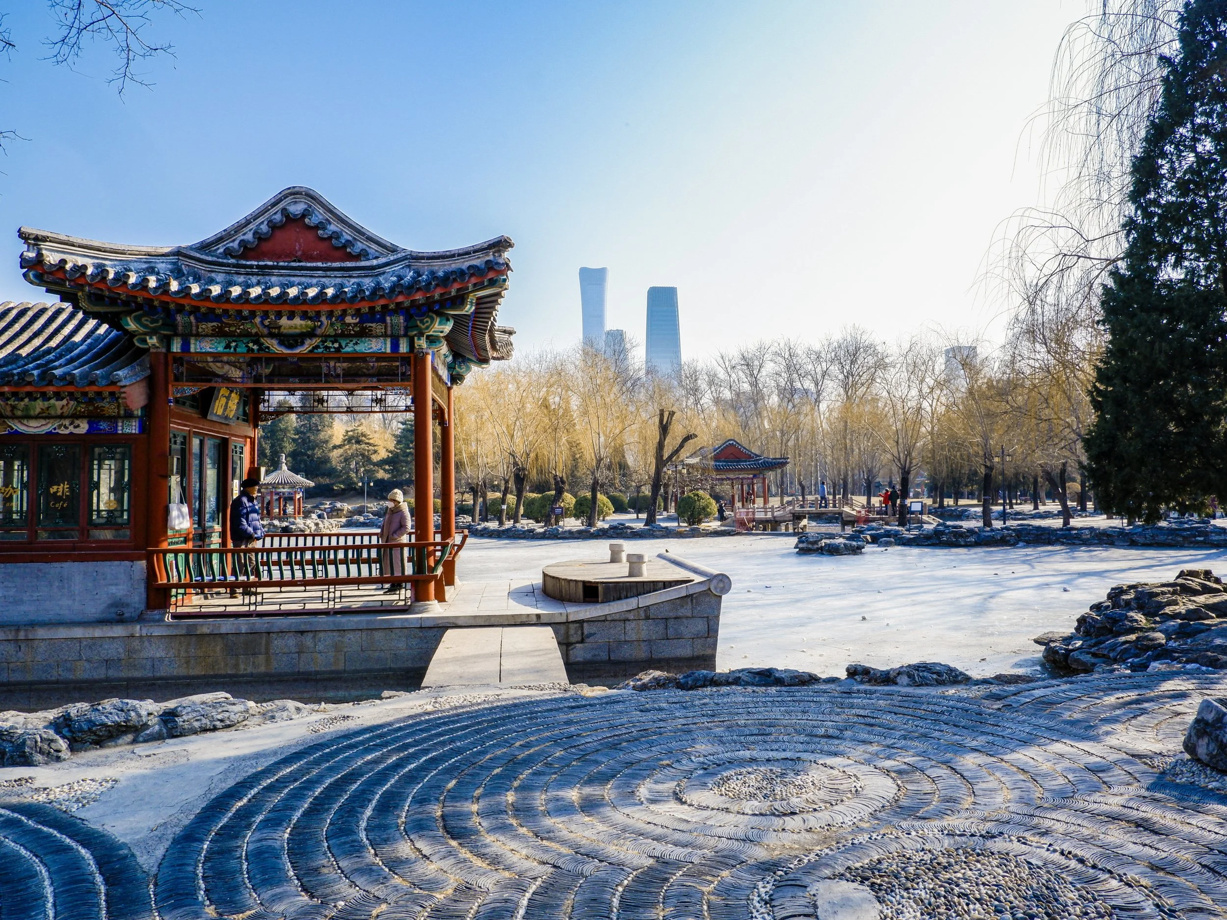 Beijing Central Business District looms beyond the Ritan Park Shifang.