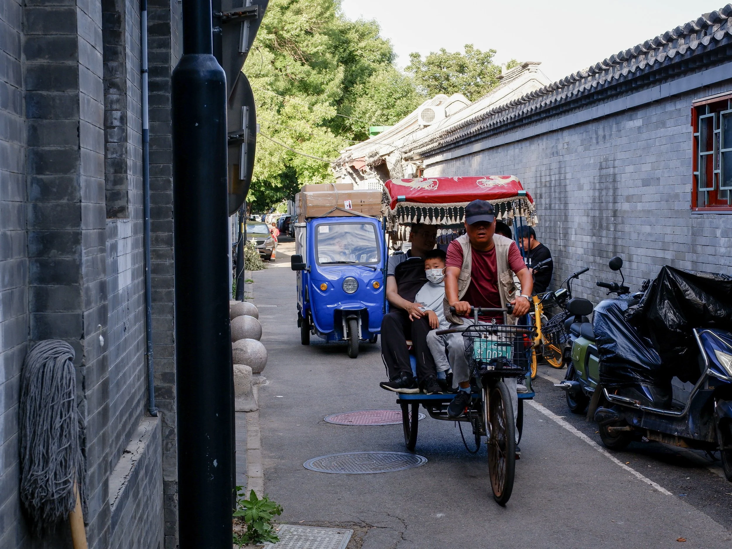 Motorized rickshaws give tours in Nanluoguxiang hutong.