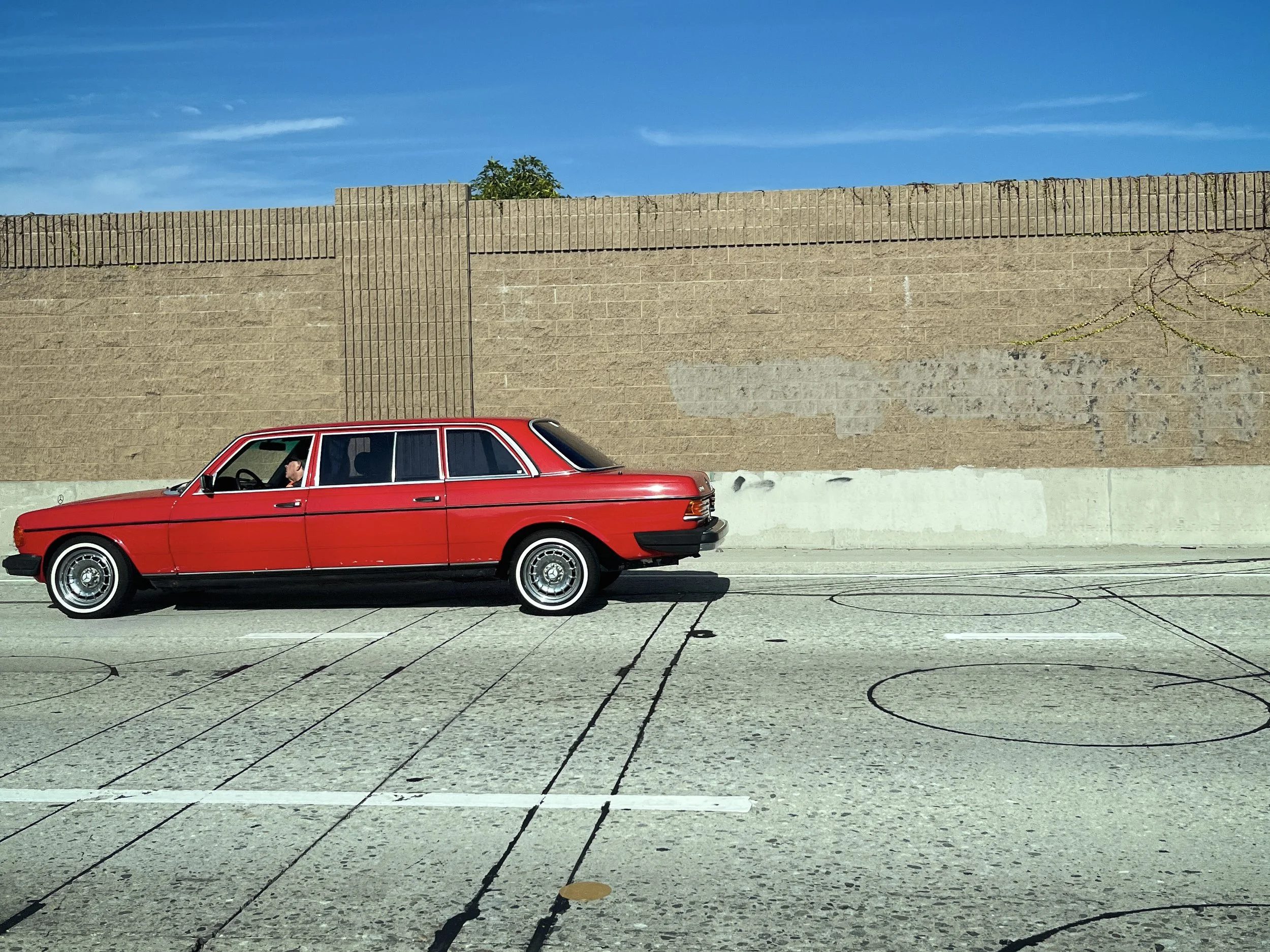 A stretch Benz on the interstate.