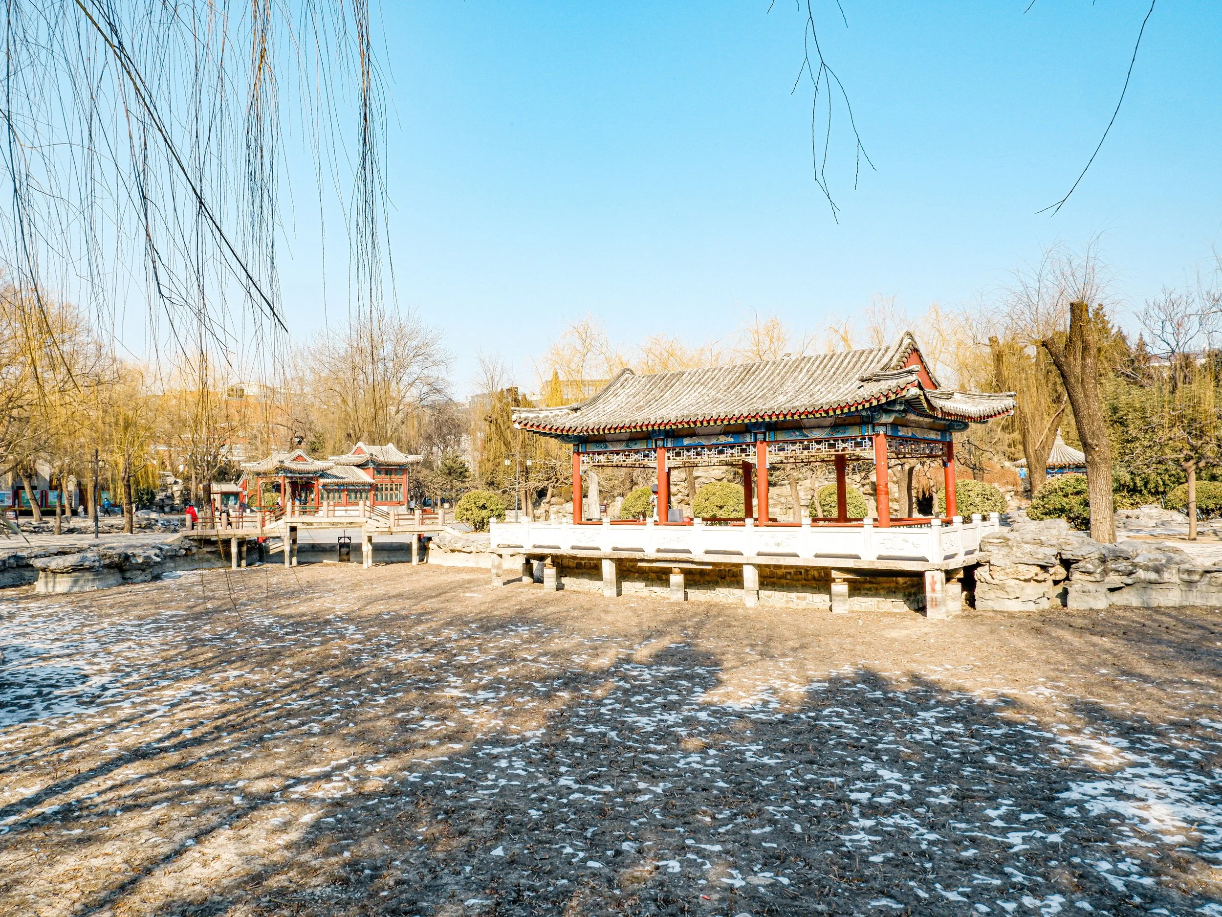 The waterside pavilion next to a drained pond.