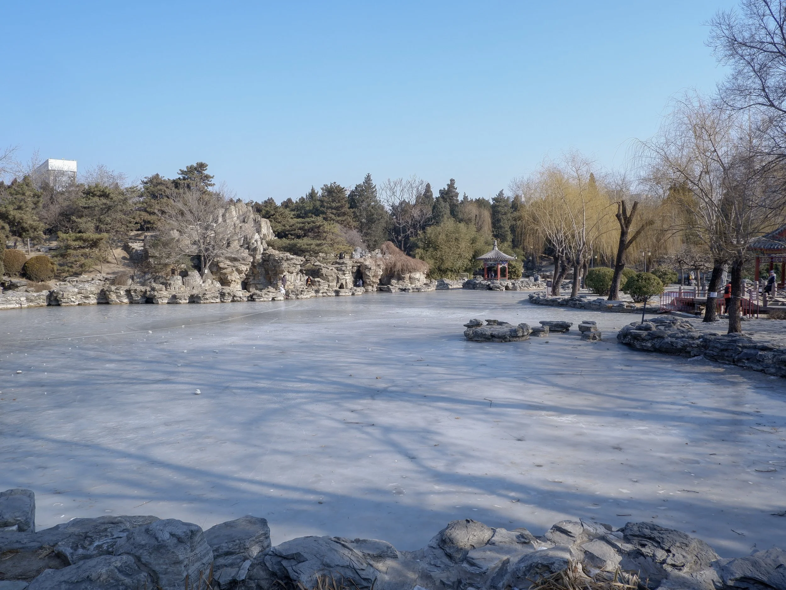 Across the frozen lake.