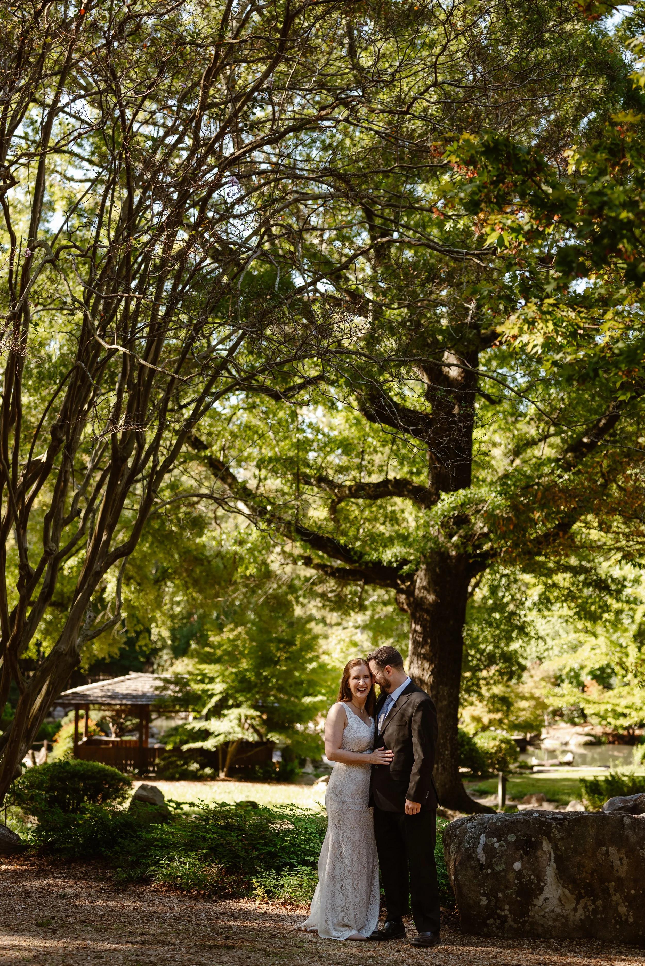 A couple in wedding attire elopes in the Birmingham Botanical Gardens