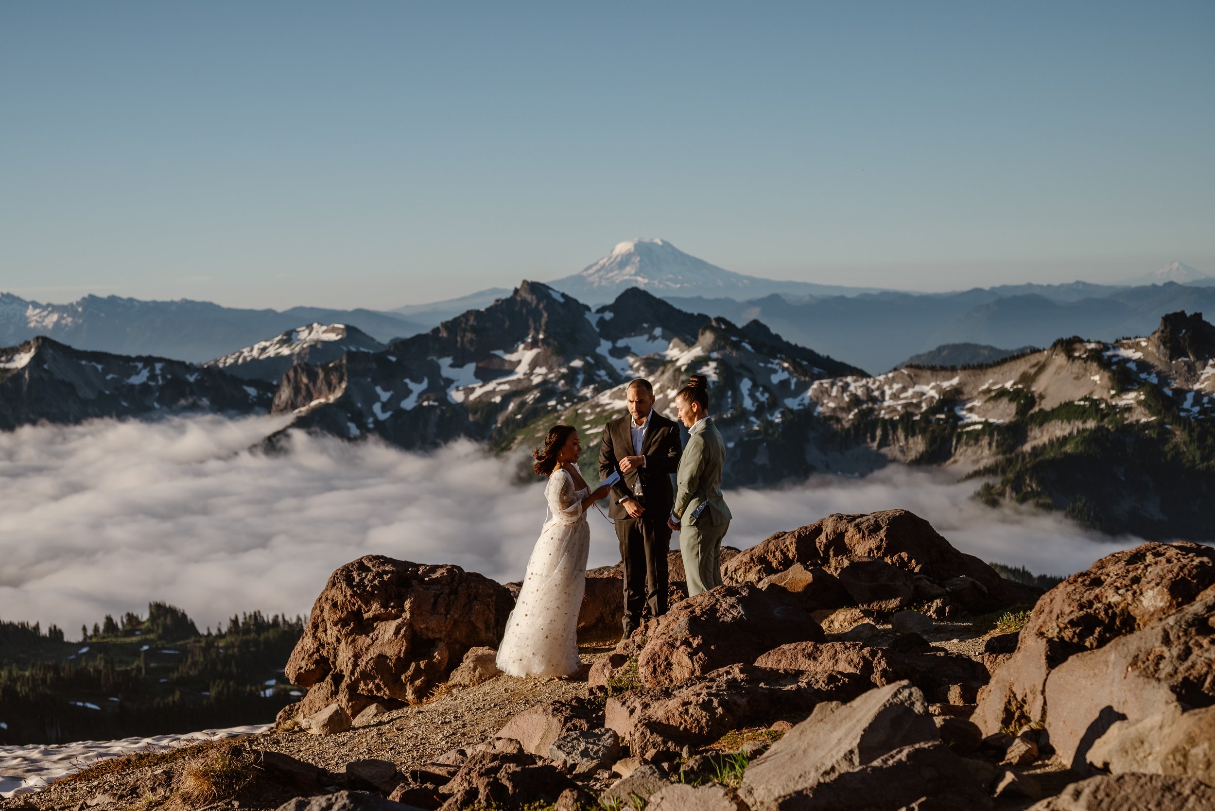 An LGBTQ couple says their vows during an adventure elopement at Mount Rainier National Park
