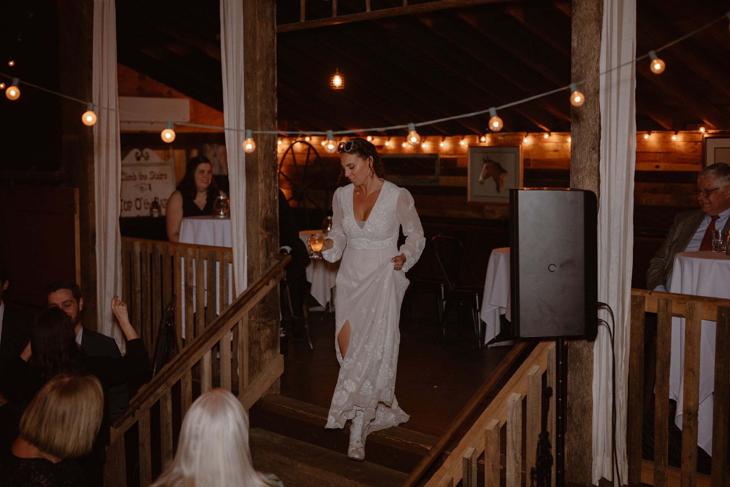 A boho western bride at her rustic barn fall wedding