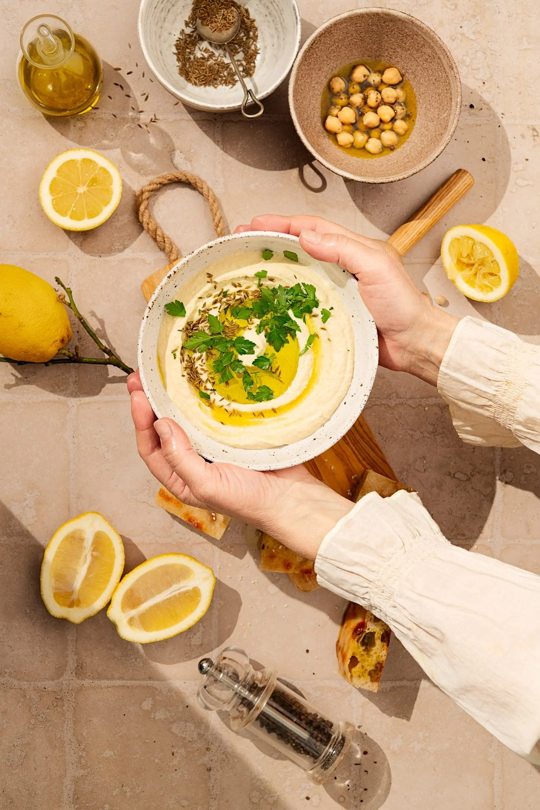 hummus high key, hard light, summer, hands, lemon, parsley, cumin, middle east, mezze, 