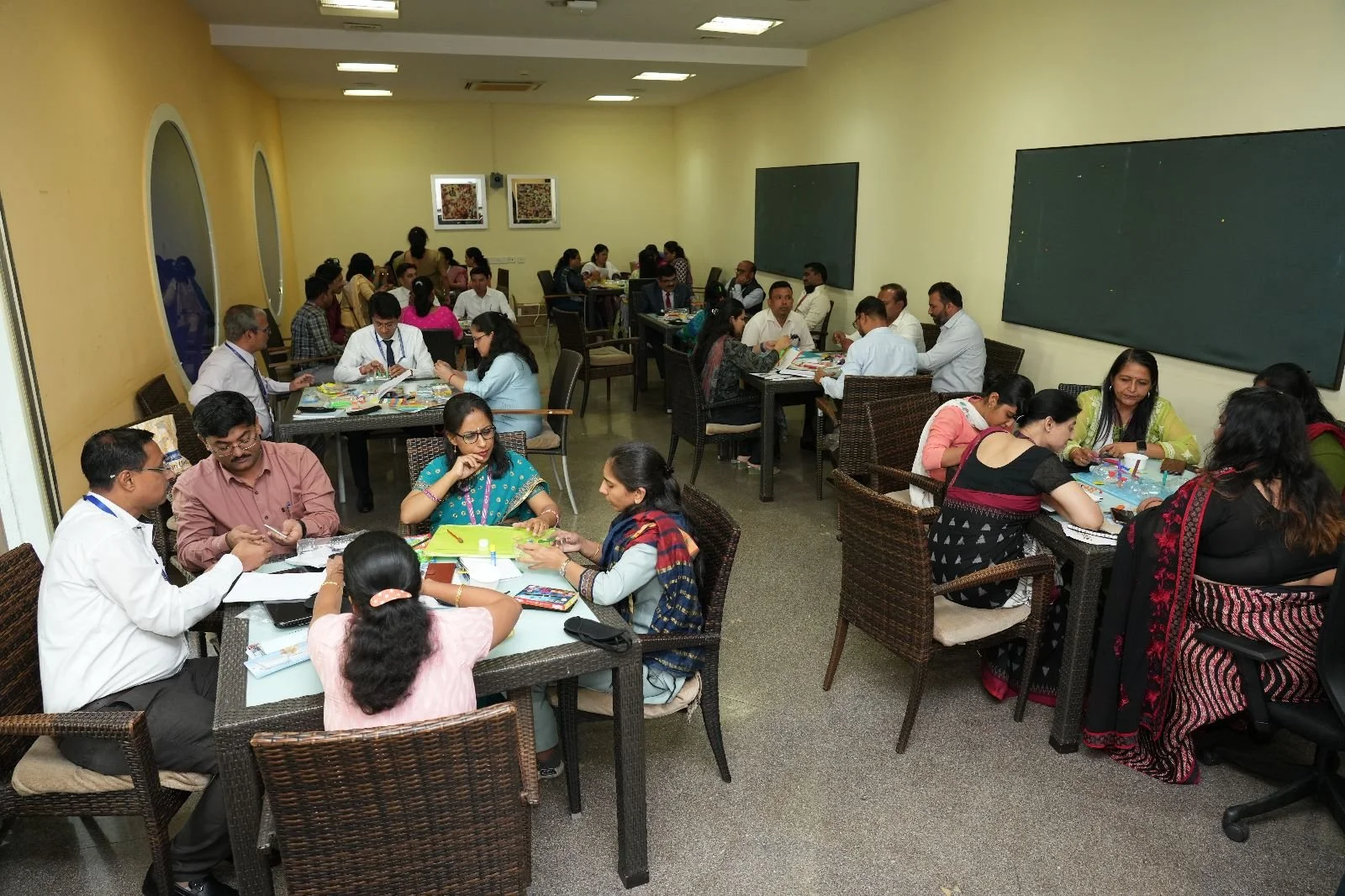 Teachers and school leaders from 7 Adani schools brainstorming over a STEM problem