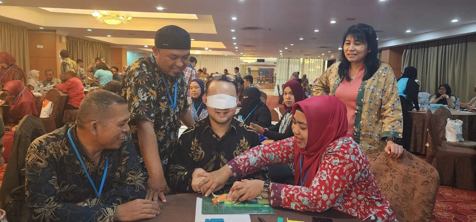  Participants were then given a task to create a cutting tool for blind individuals using the provided materials to design. Here is a meriSTEM@NIE consultant testing one such prototype 