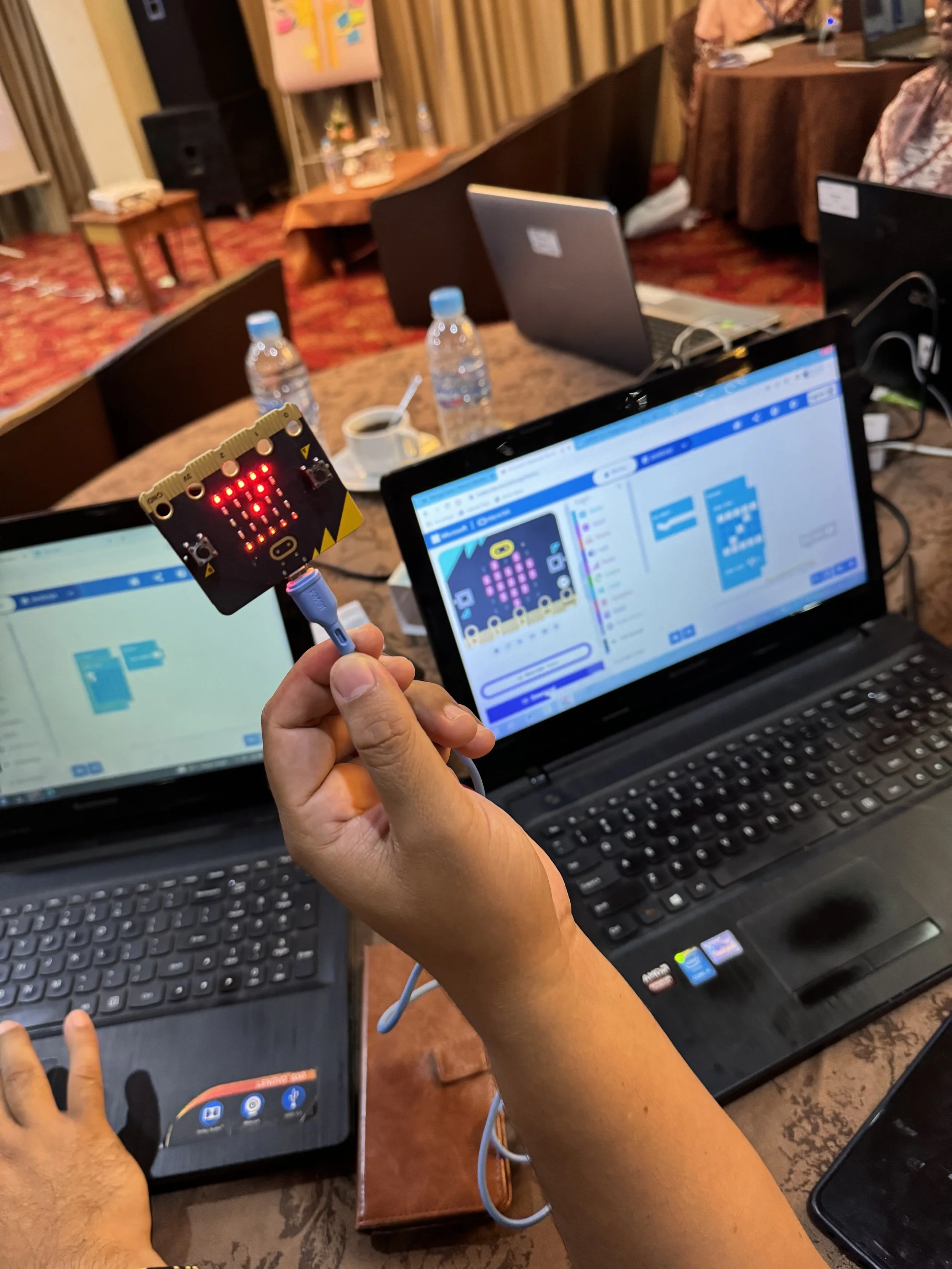  Participants coding during the micro:bit workshop conducted by Dr Timothy Tan 
