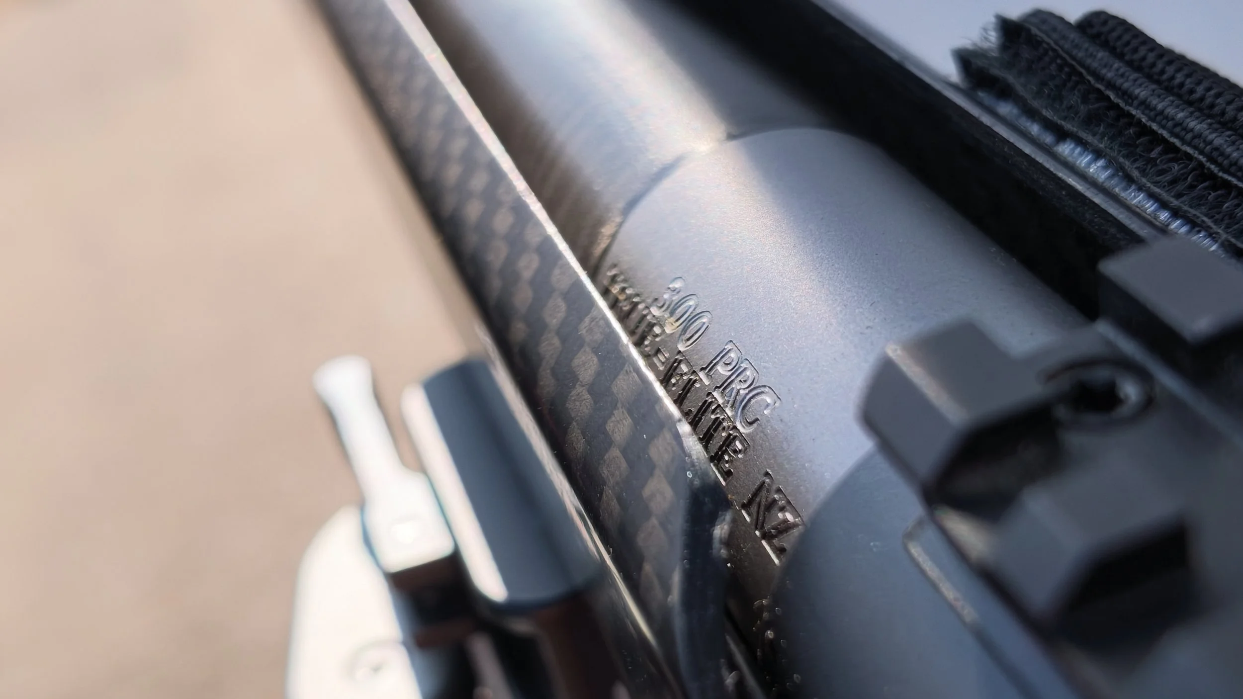 Close-up of a vintage typewriter showing part of the metal type basket with embossed characters.