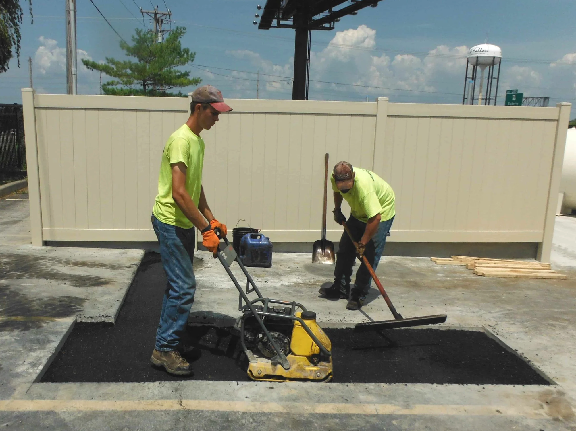 two ninjas excavating patching a parking lot for a O'fallon Missouri business