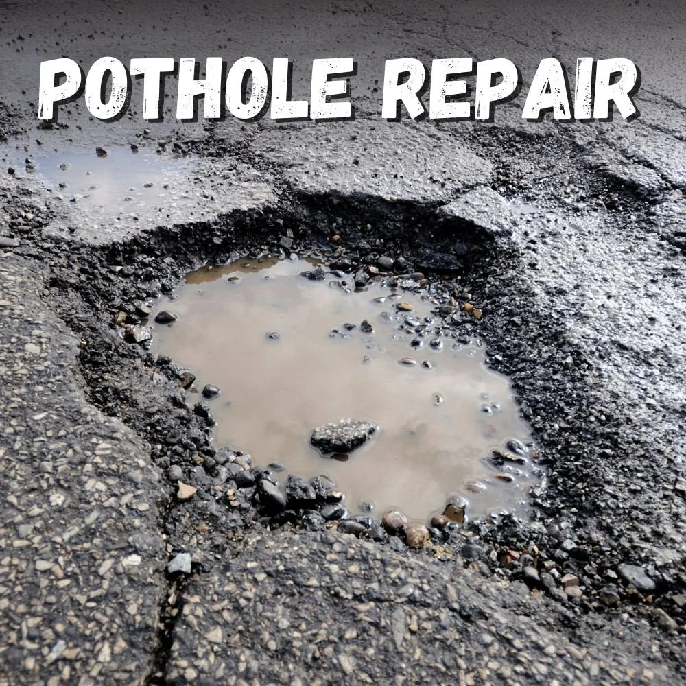 Pothole Repair Text over image of a pothole with water inside and cracks at its seams