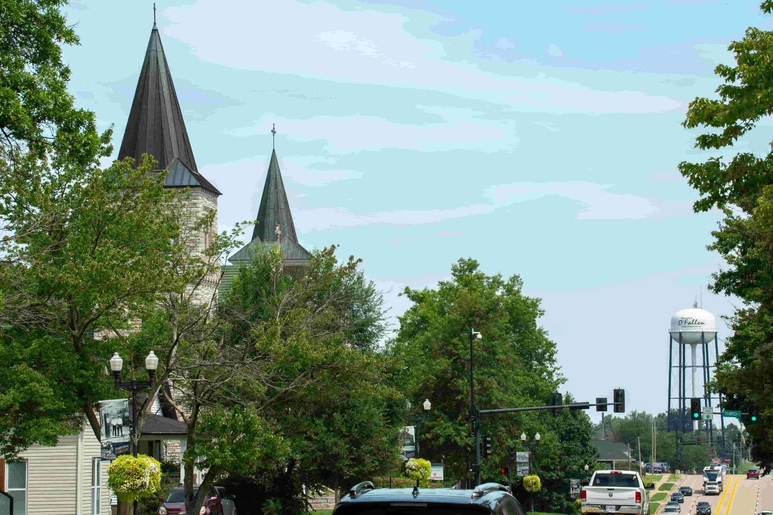 OFallon sky line on main street, you can see a church and an Ofallon city water tower O'Fallon Asphalt Repair
