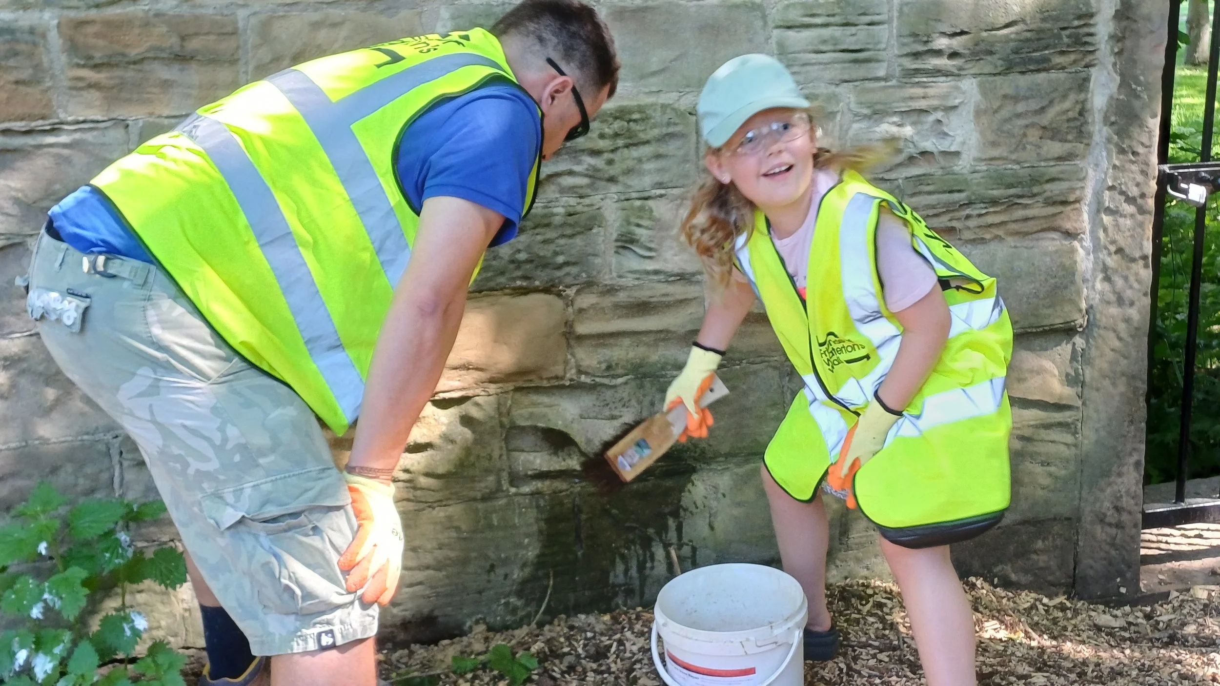 Father and daughter working on the wall.jpg