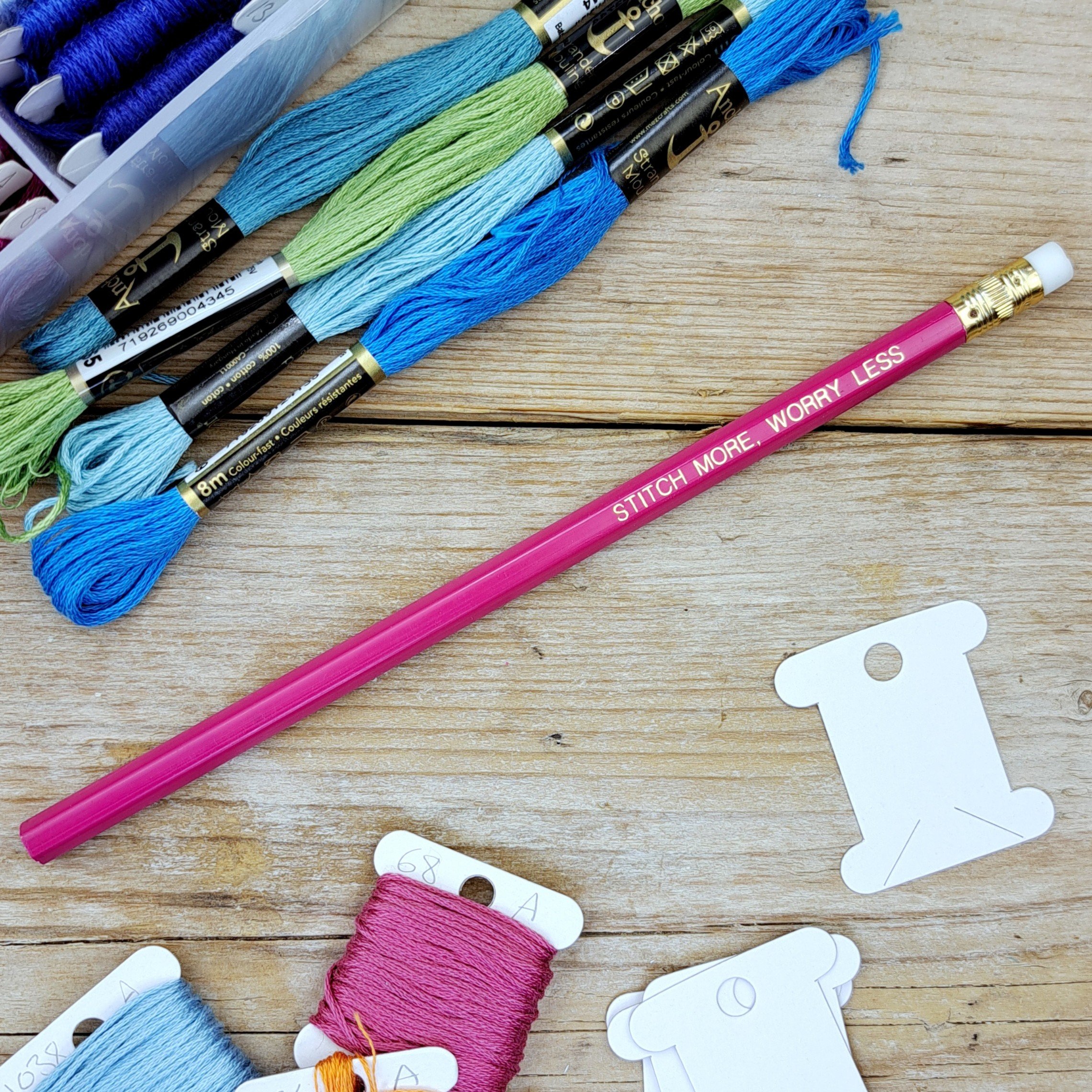 Full-length pink "Stitch More, Worry Less" HB pencil with unsharpened graphite tip
