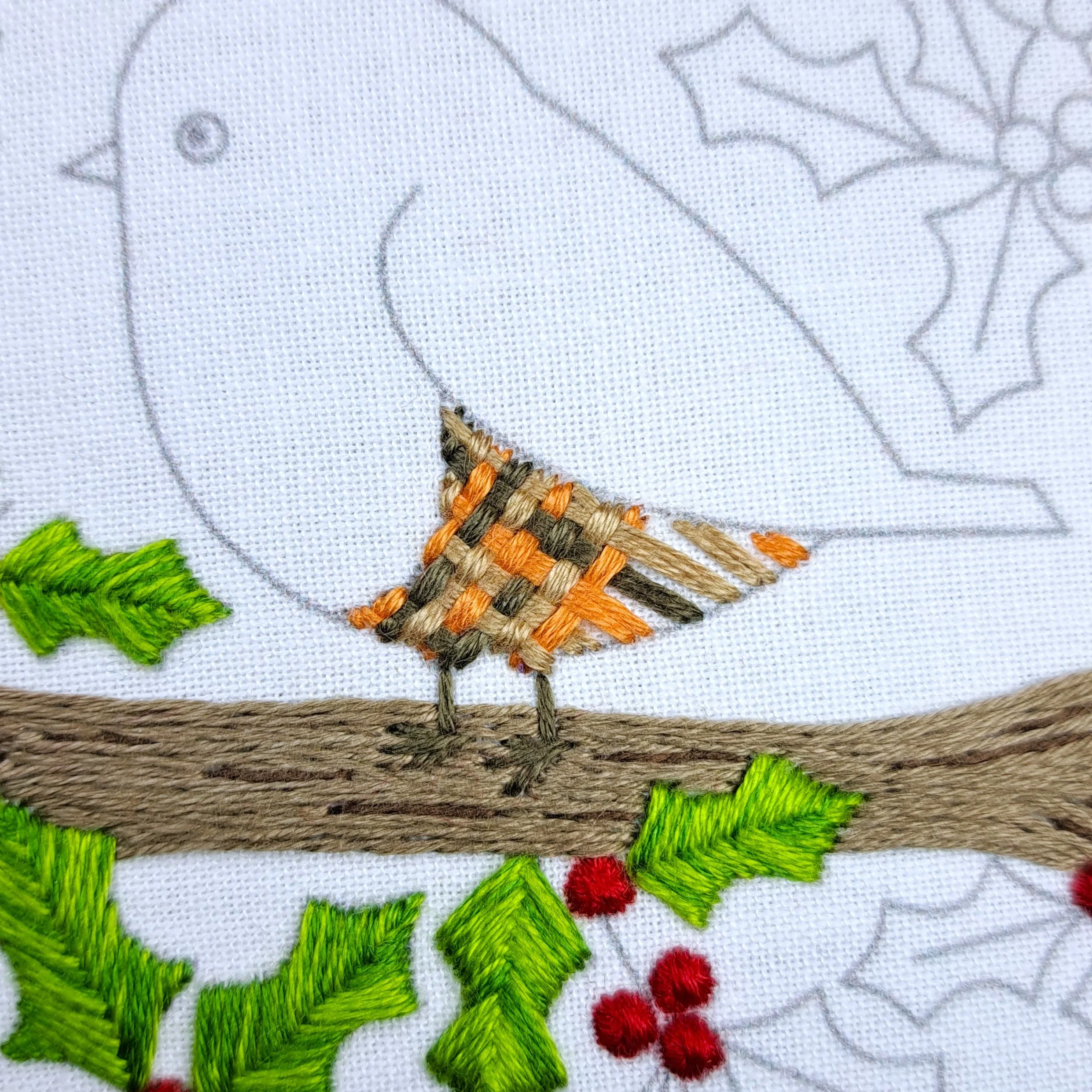 Close-up of the robin’s belly with foundation stitches complete and half the Basket Weave Stitch in place.
