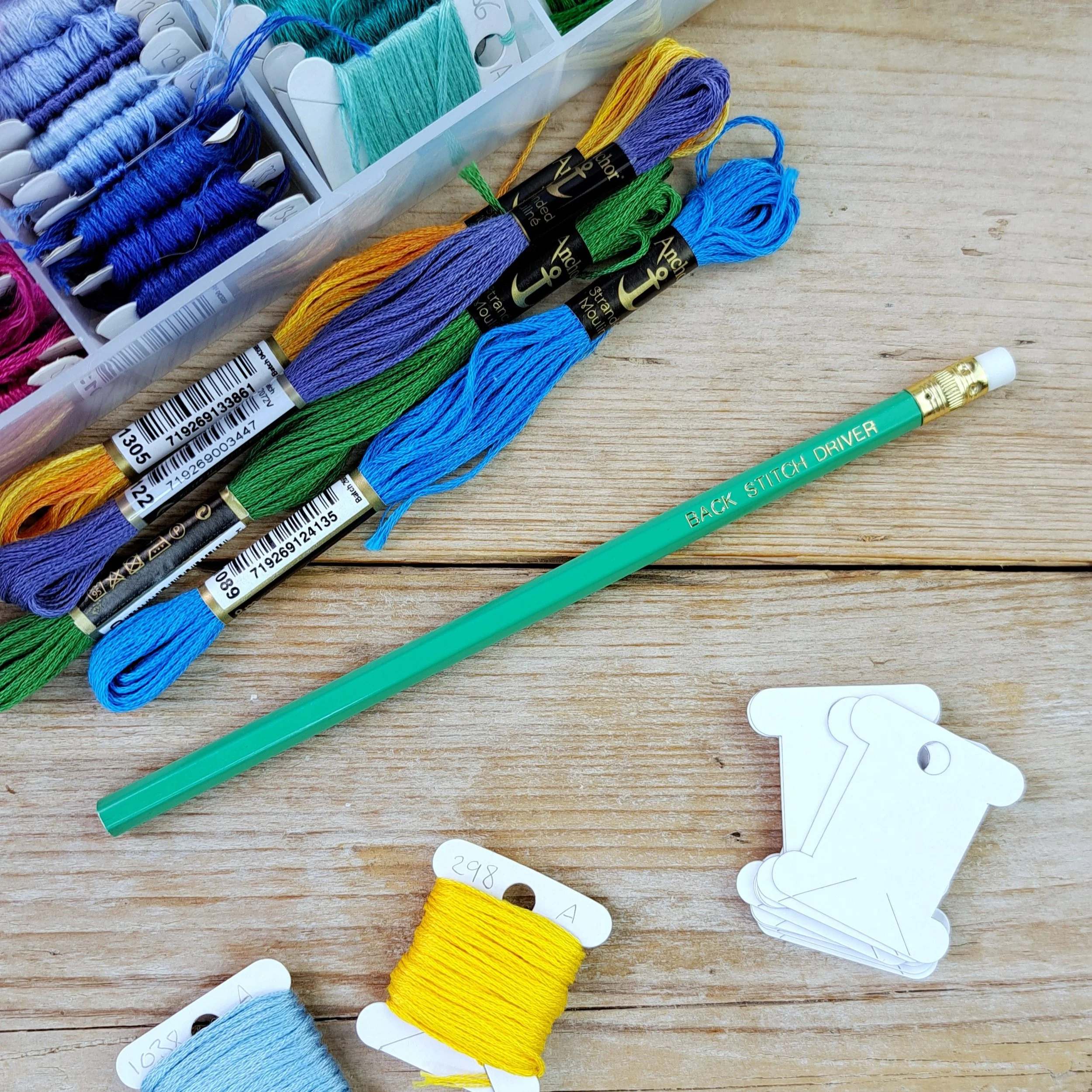 Full-length green "Back Stitch Driver" HB pencil with unsharpened tip
