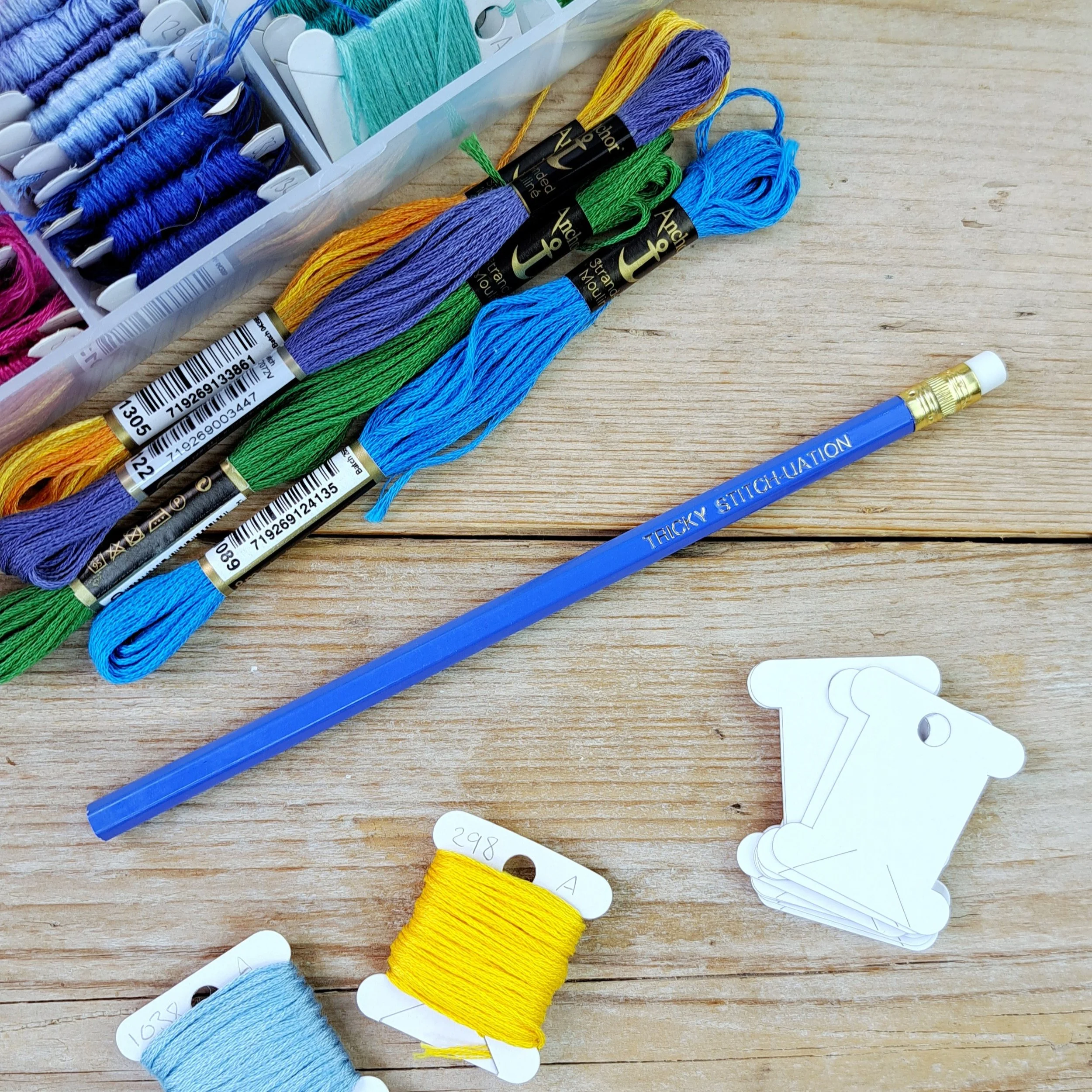 Full-length blue "Tricky Stitch-uation" HB pencil with unsharpened tip