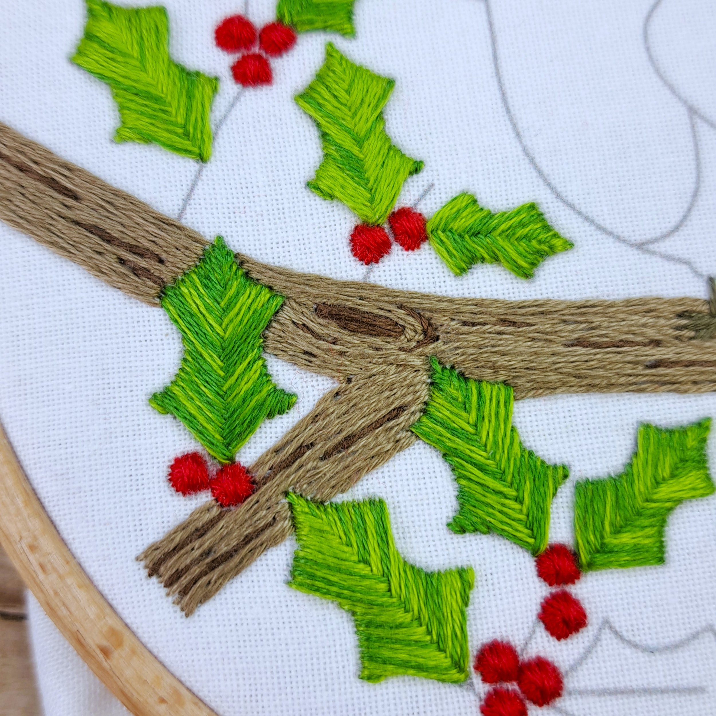 Close-up of the completed end of a branch stitched with brown Stem Stitch.