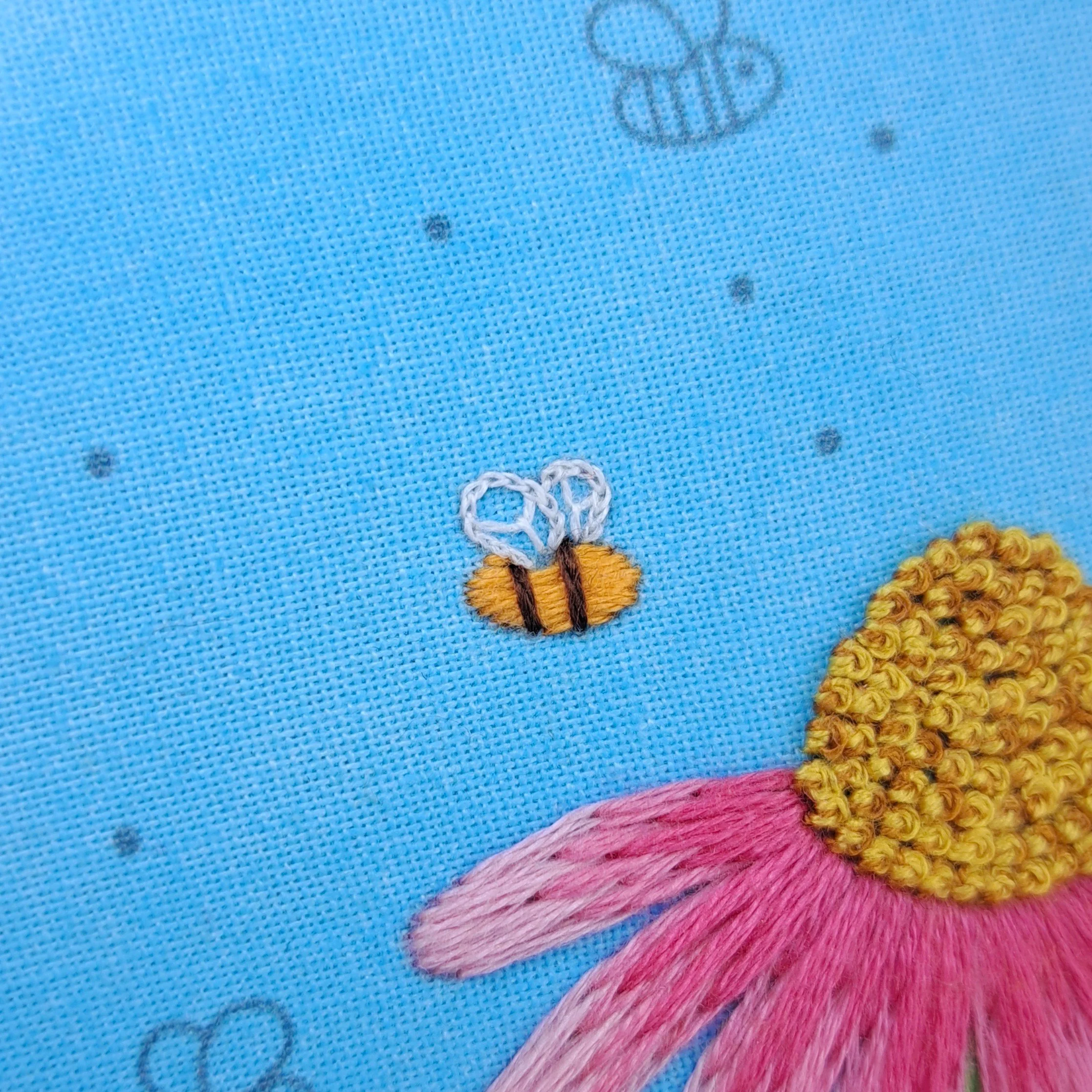 Close-up of the brown Straight Stitch used to embroider the smaller bees stripes.