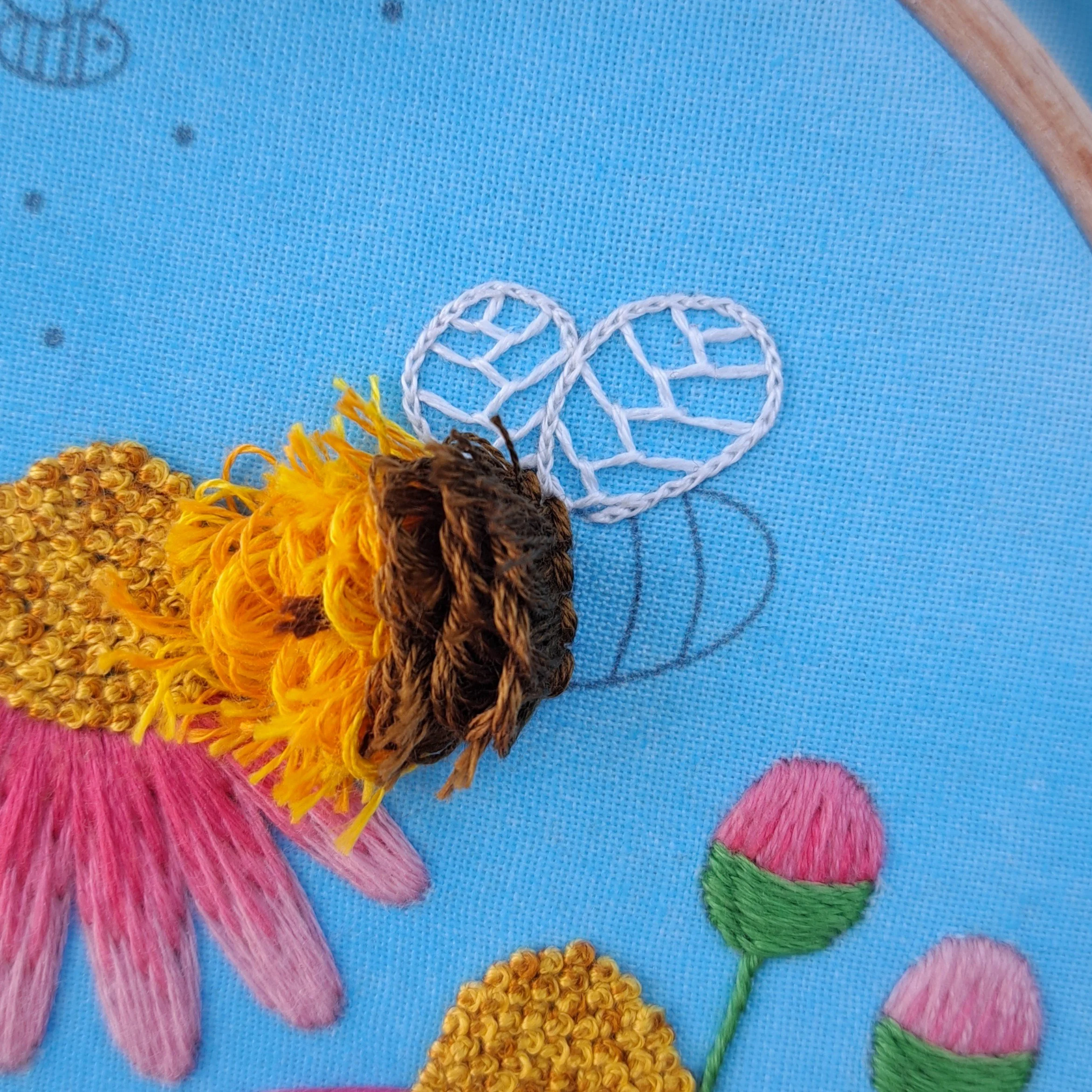 Close-up of the brown Turkey Stitch used to embroider one of the bees stripes.