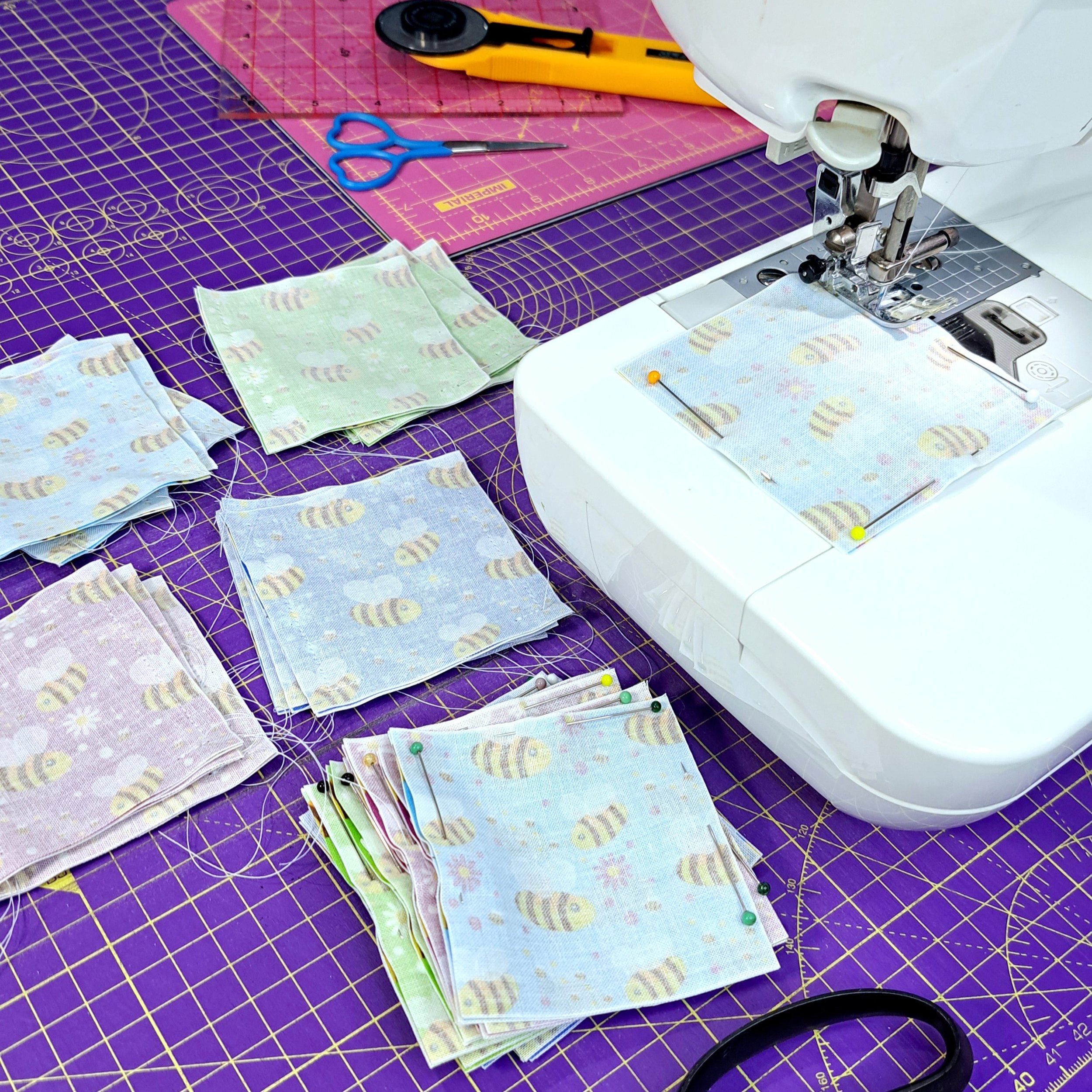 Liz sewing handmade embroidery accessories on a sewing machine