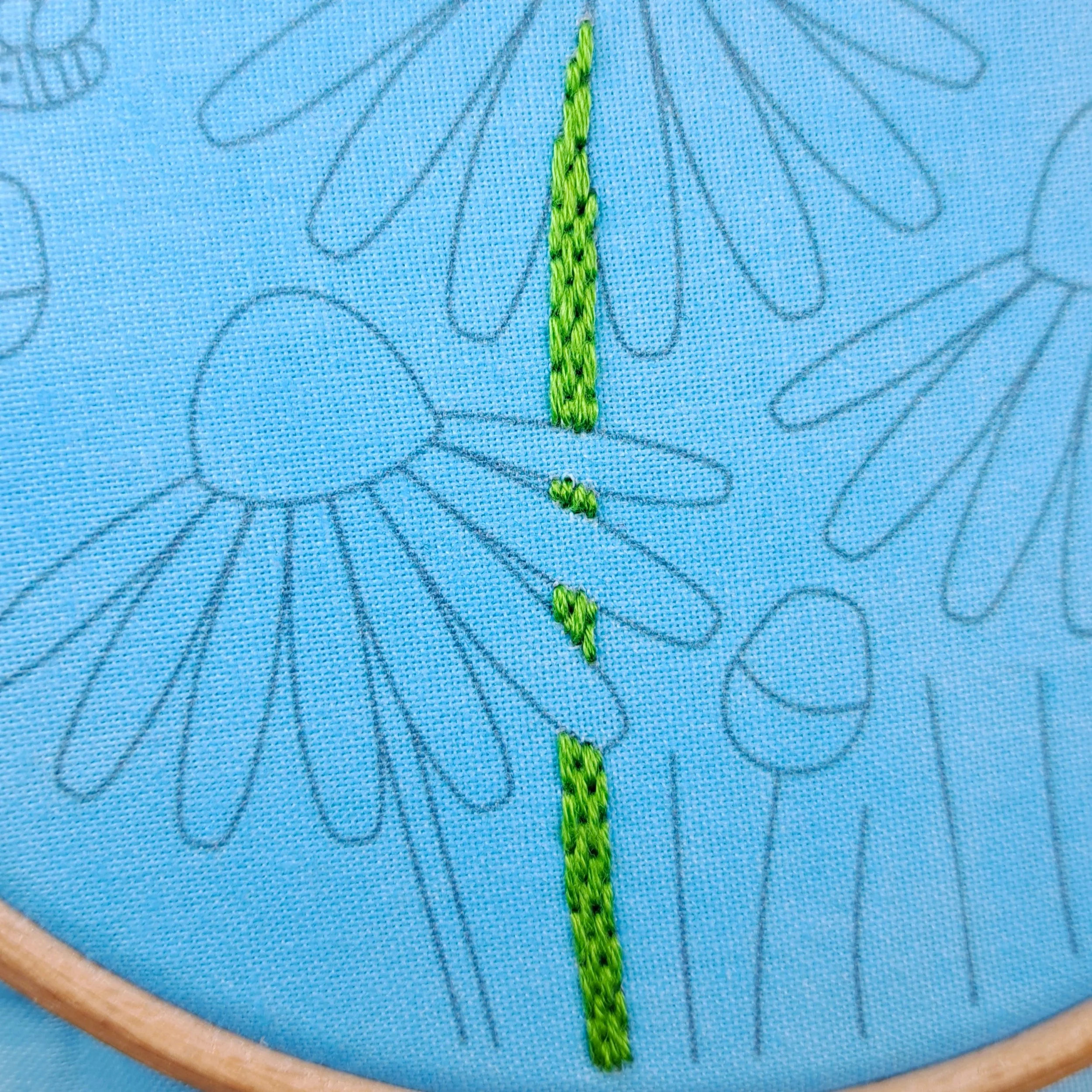 Close-up of the green Brick Stitch used to embroider the stems of the Echinacea flowers.