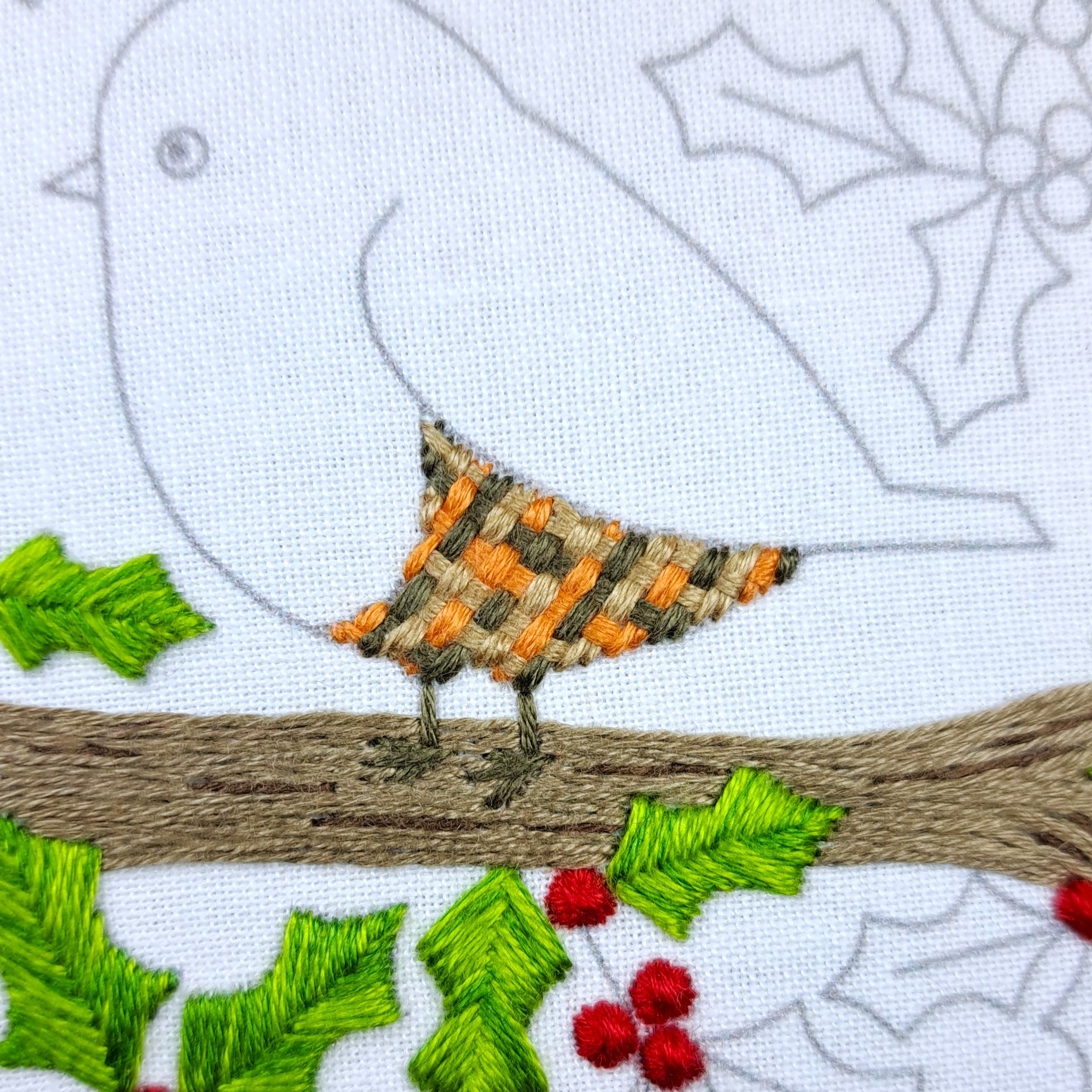 Close-up of fully stitched robin belly using Basket Weave Stitch.