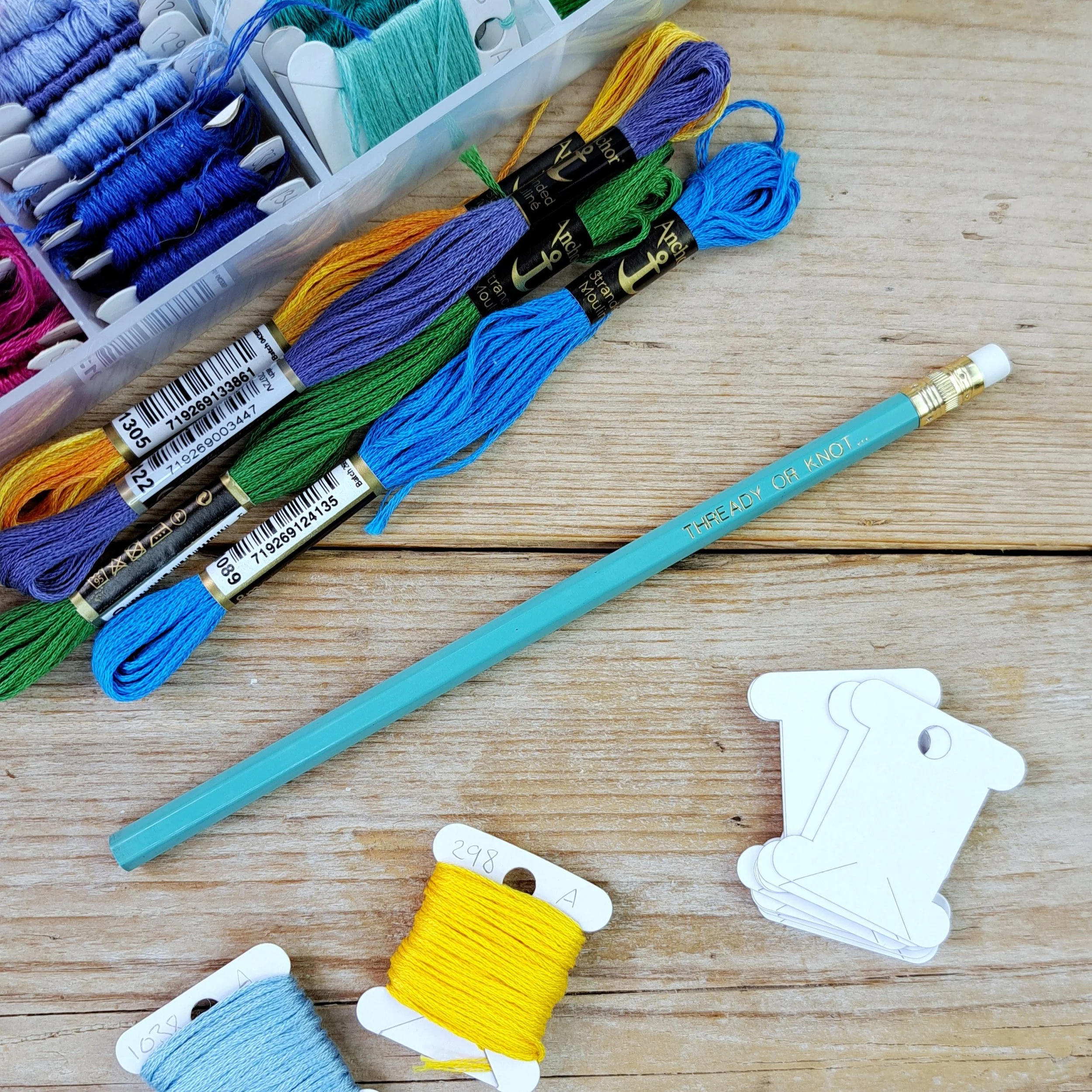 Full-length teal "Thready or Knot" HB pencil with unsharpened tip