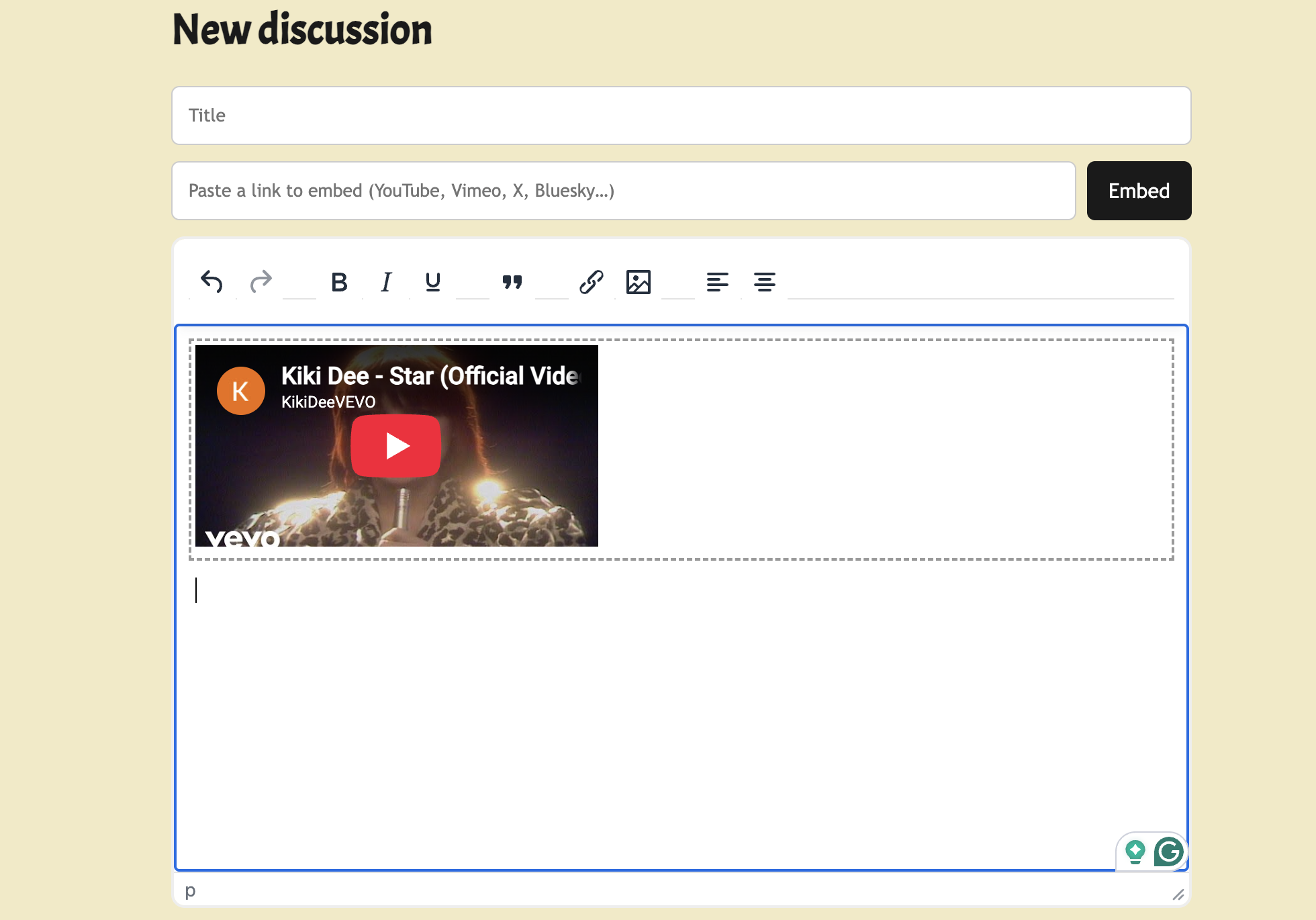 A screenshot of a web editing interface with a YouTube video embedded. The video features a performer with bright hair, holding a microphone, and the title indicates it is 'Kiki Dee - Star (Official Video).' The page titled 'New discussion' has input fields for a title and URL.