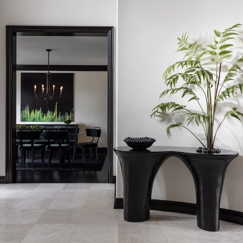 This dramatic entryway from a recent project features a bespoke organic table that incorporates live greenery. It is hand-sculpted, customized to sit flush against the curved wall. Integrating nature into spaces enhance and add distinction.⁠
⁠
📸 by 