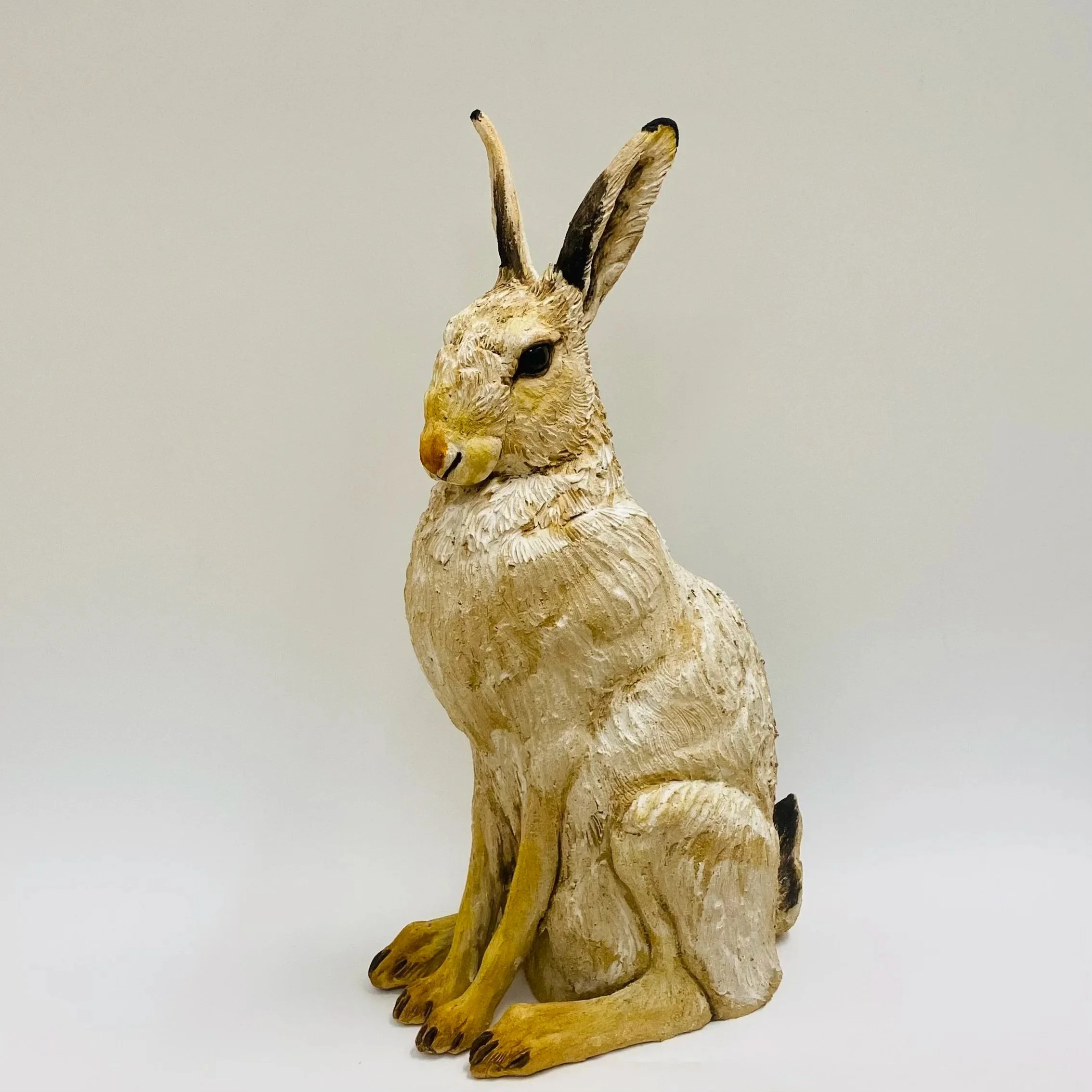 Winter Hare by British wildlife artist Karen Fawcett. Hand made ceramic, H48cm W27cm D18cm SOLD