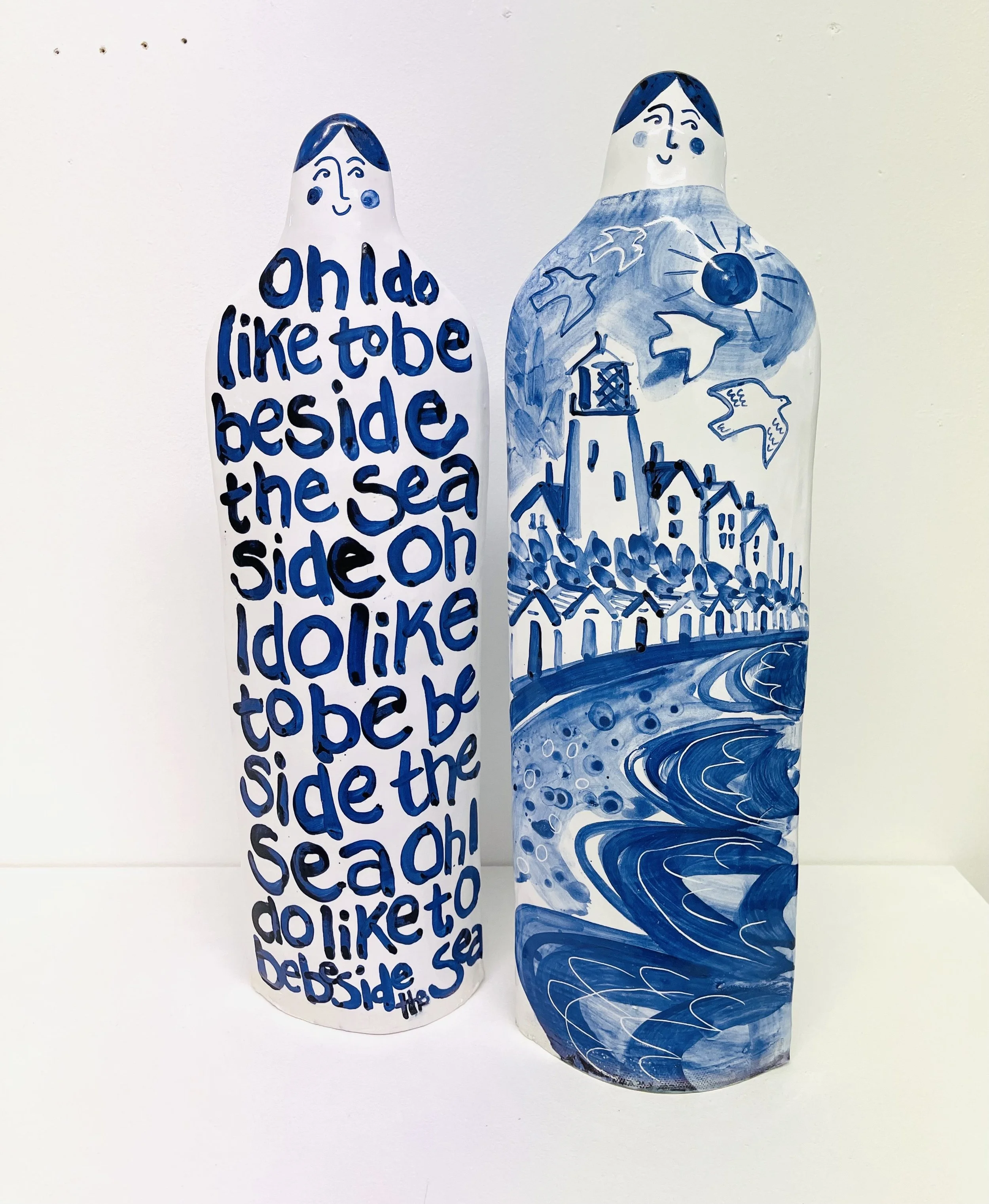 Hand made tin oxide glaze ceramic figures, each measuring H46cm W15cm D7cm approx. 'Oh I Do' figure (left) £295.00 'Southwold' figure (right) £295.00