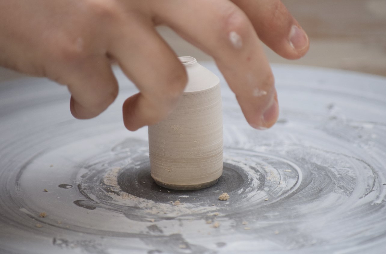 picking a mini pot from the wheel.jpg