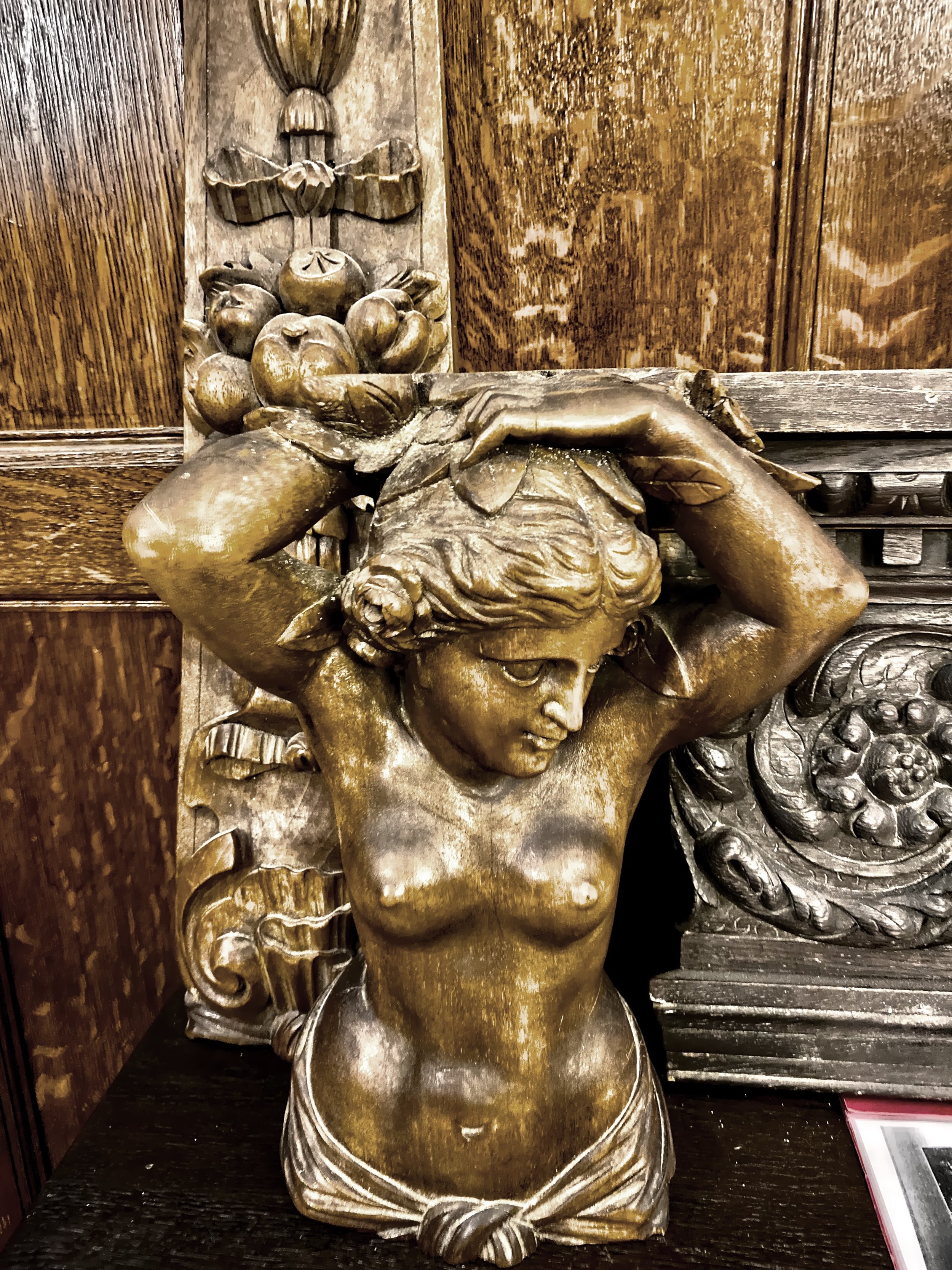  One of the wood carvings on display in the hallway 