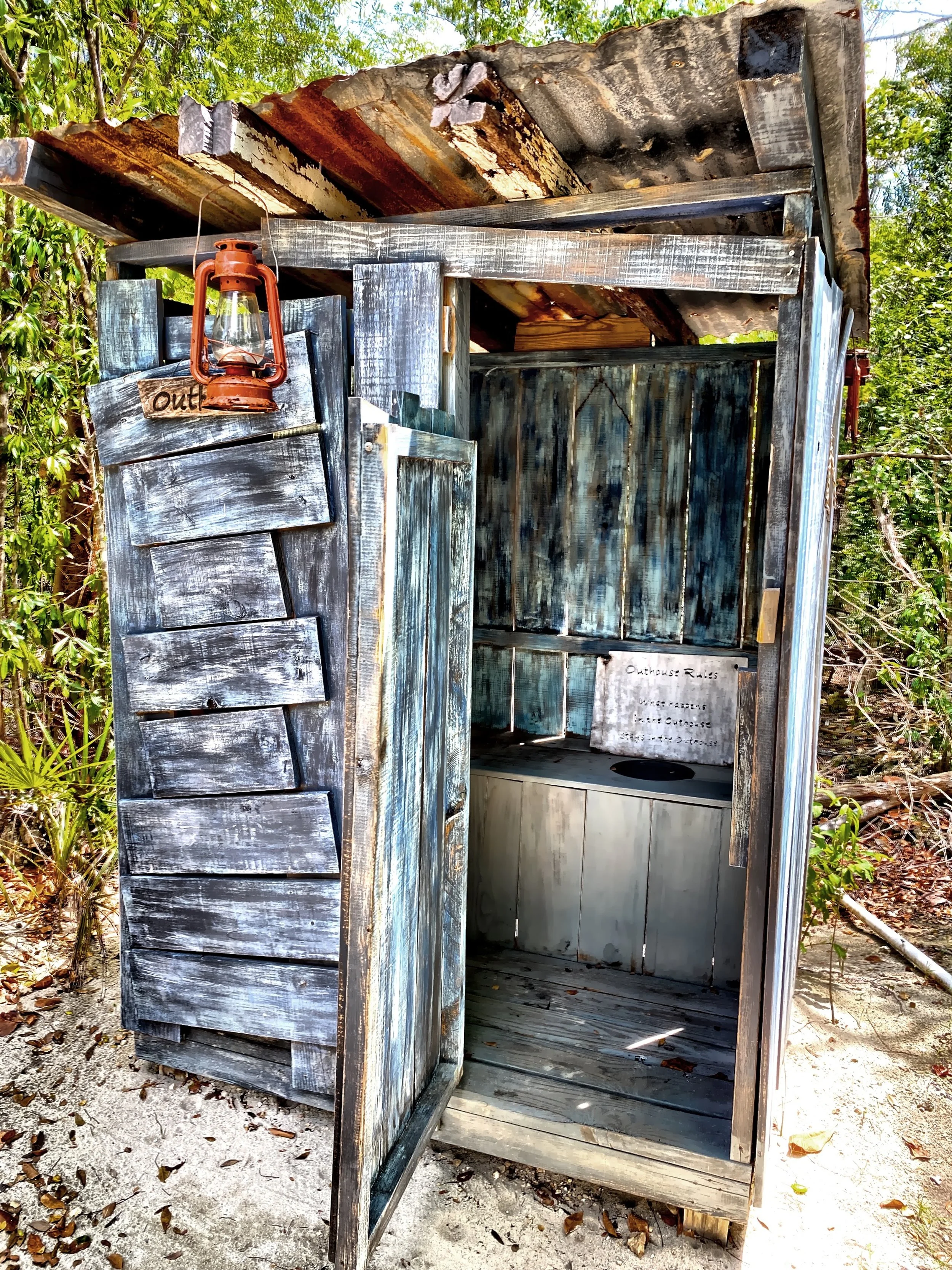  This is an outhouse displayed in the Heritage Garden in Queen Elizabeth II Botanic Park. 